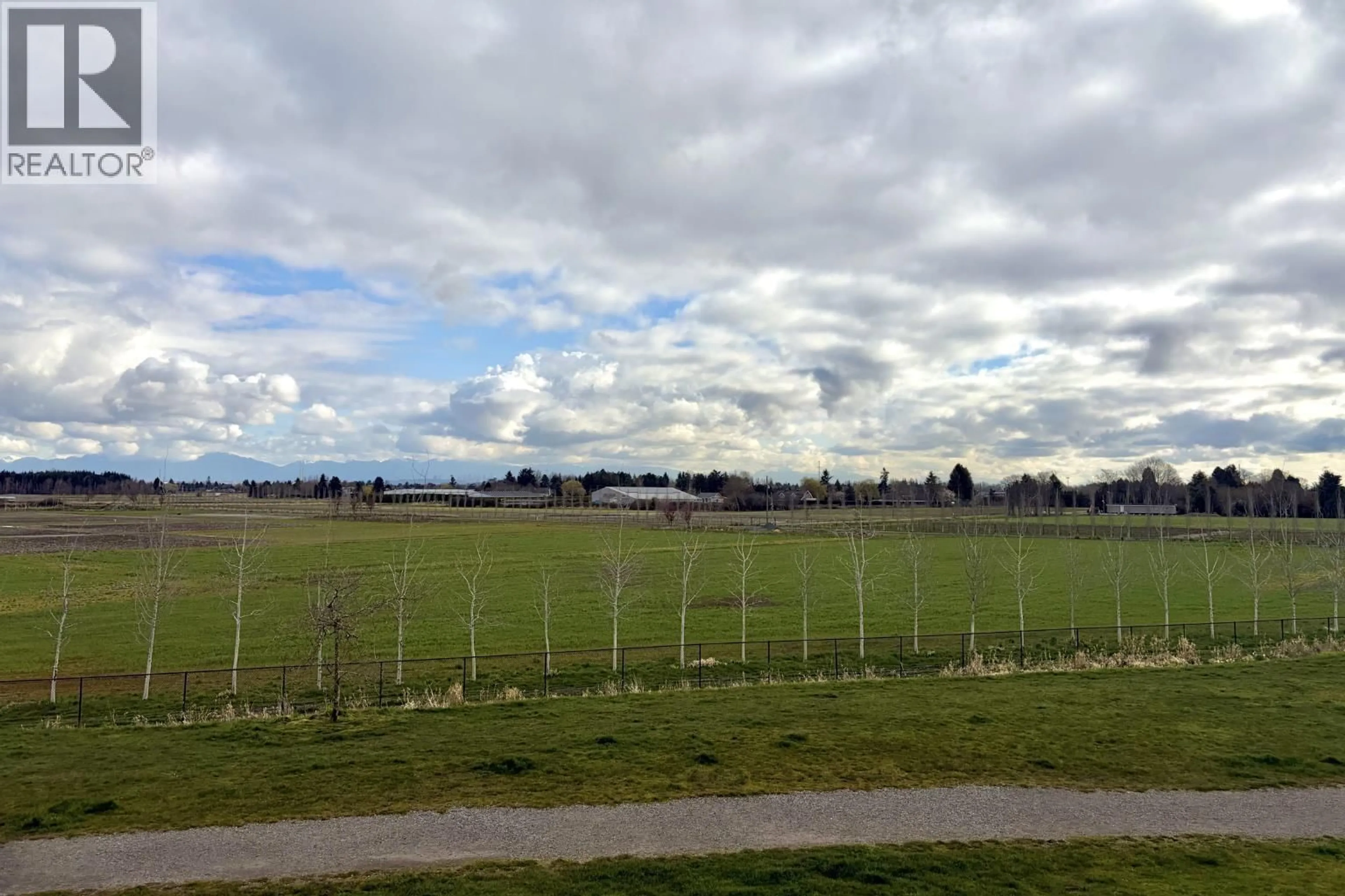 A pic from outside/outdoor area/front of a property/back of a property/a pic from drone, mountain view for 202 - 6233 LONDON ROAD, Richmond British Columbia V7E6R7