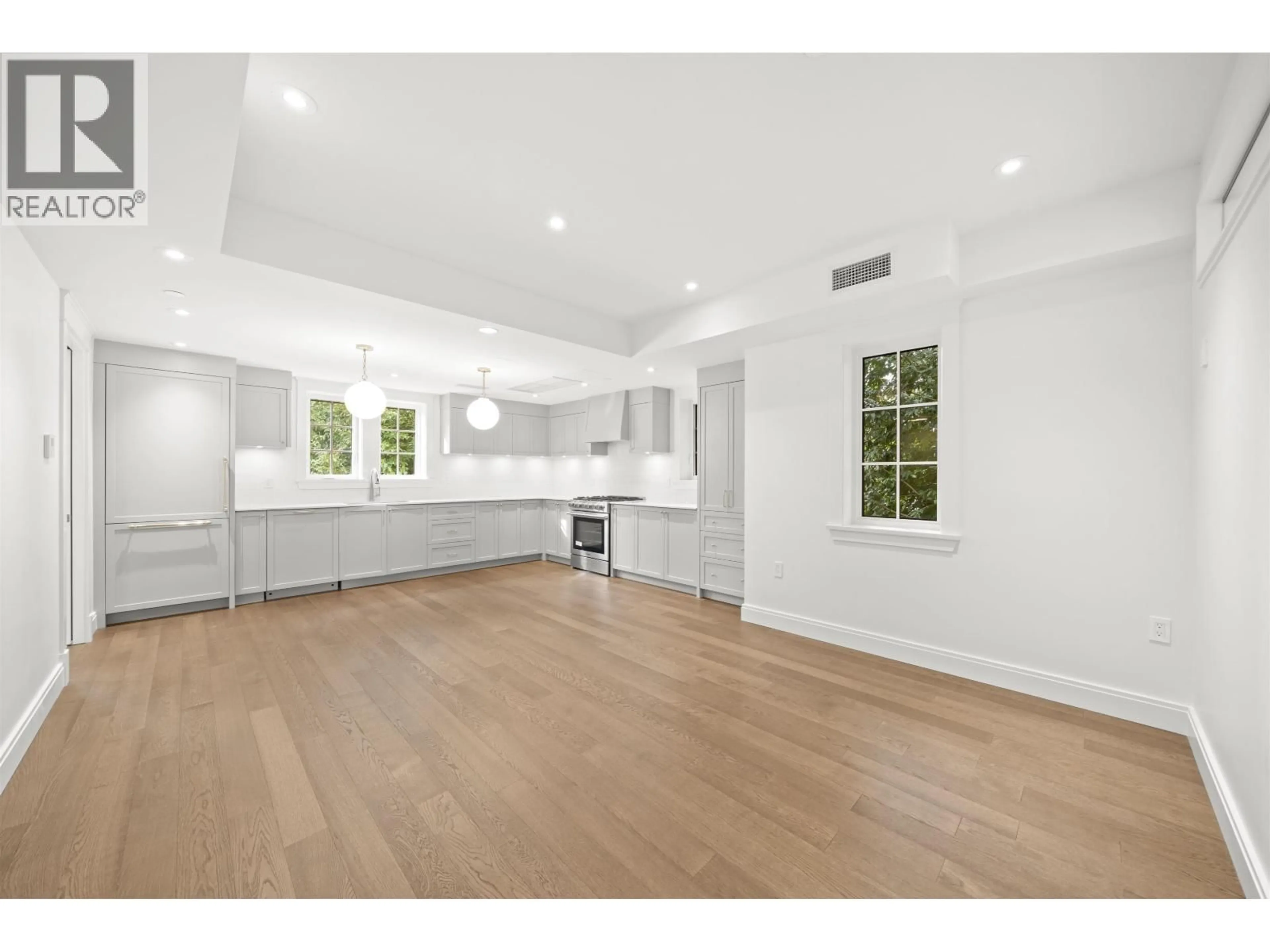 Open concept kitchen, wood/laminate floor for 5815 HIGHBURY STREET, Vancouver British Columbia V6N1Y9