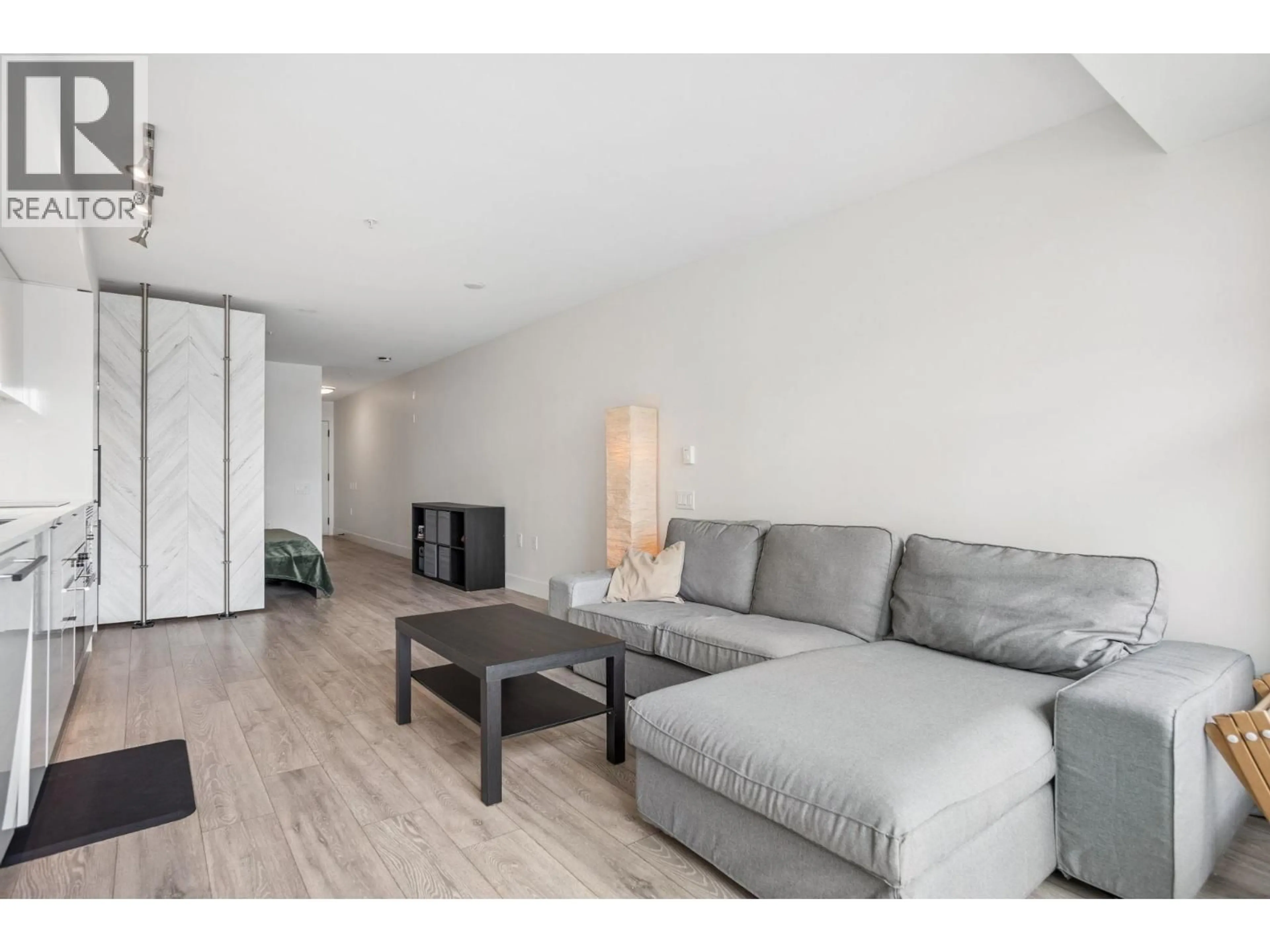 Living room with furniture, wood/laminate floor for 319 - 630 BROADWAY, Vancouver British Columbia V5T0J1