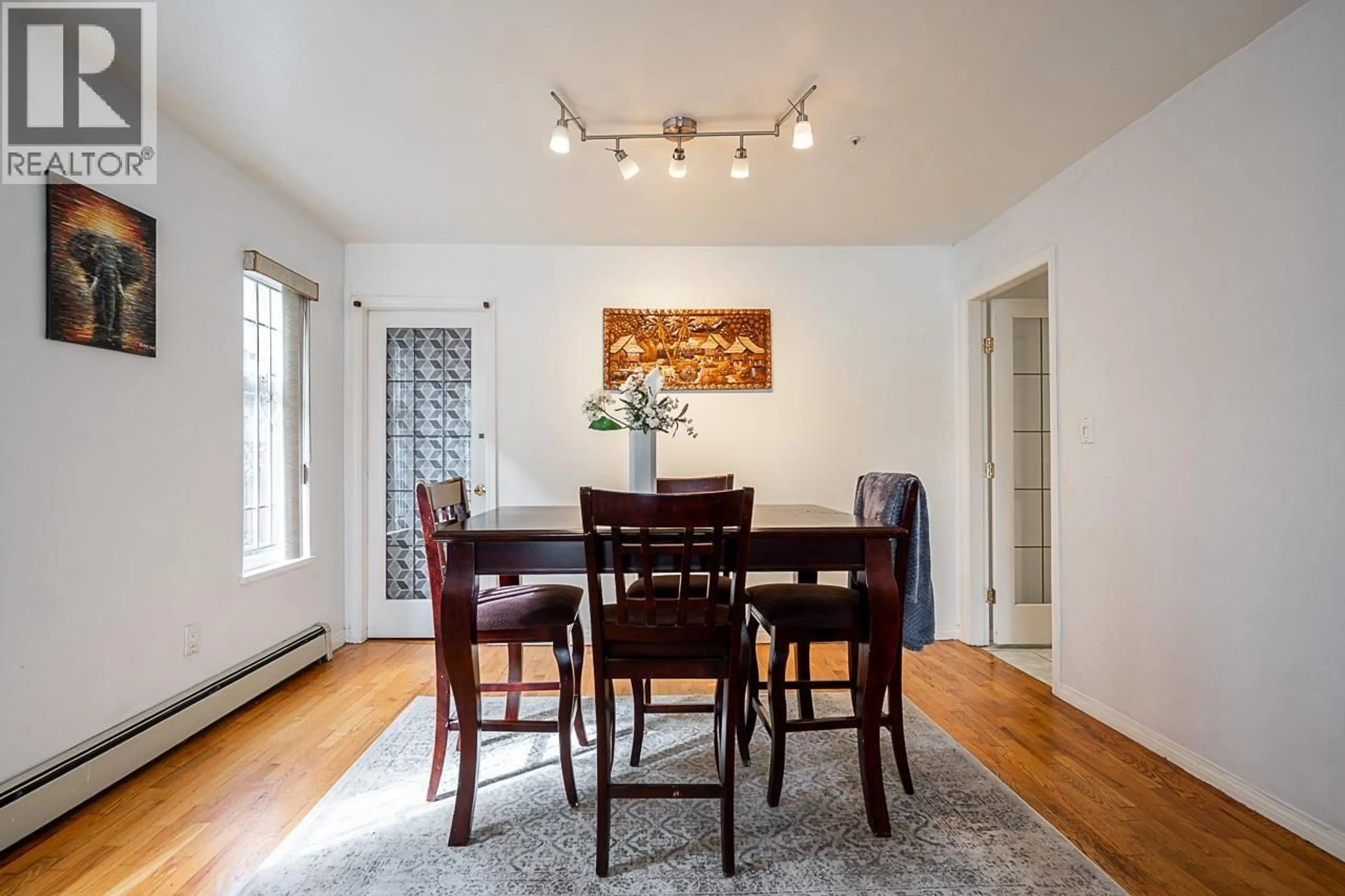 Dining room, wood/laminate floor for 1407 12TH AVENUE, Vancouver British Columbia V5N2A1