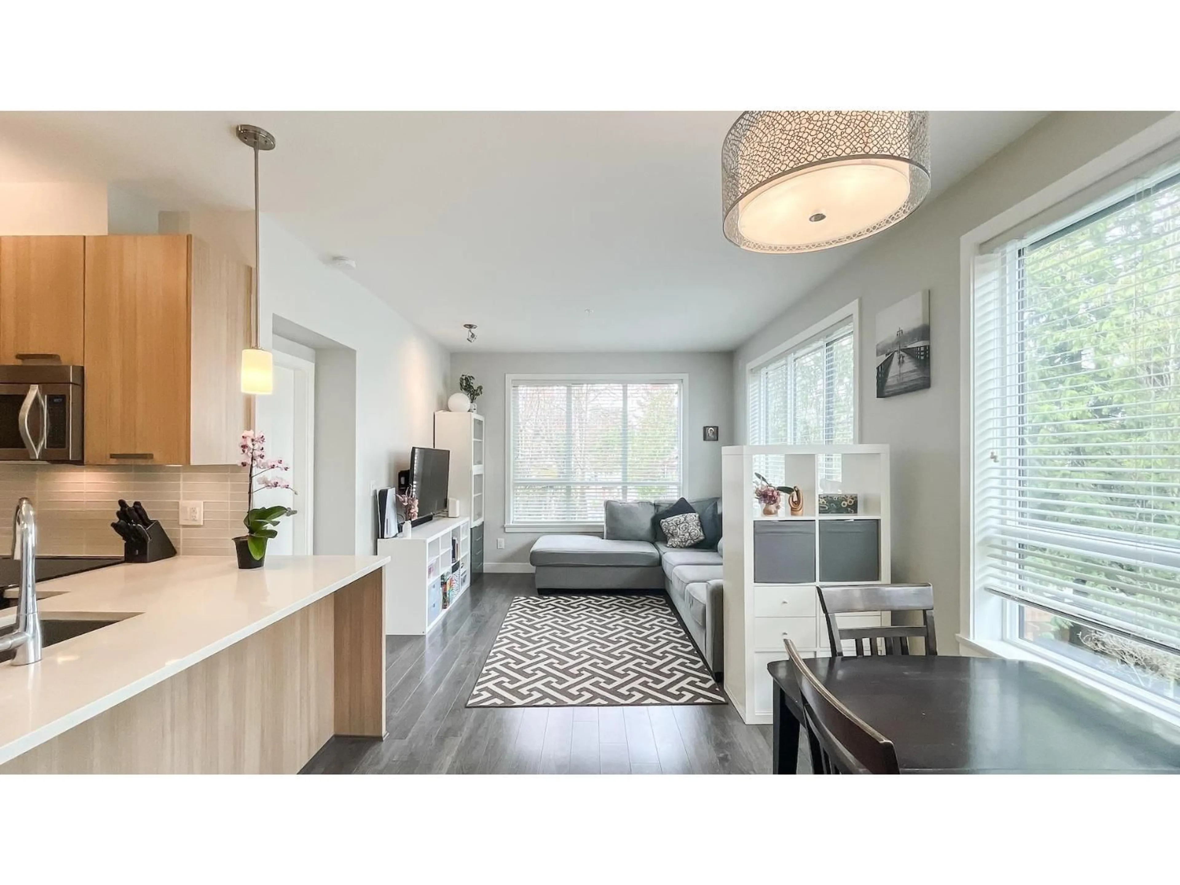 Open concept kitchen, wood/laminate floor for 207 - 10455 154 STREET, Surrey British Columbia V3R0C5