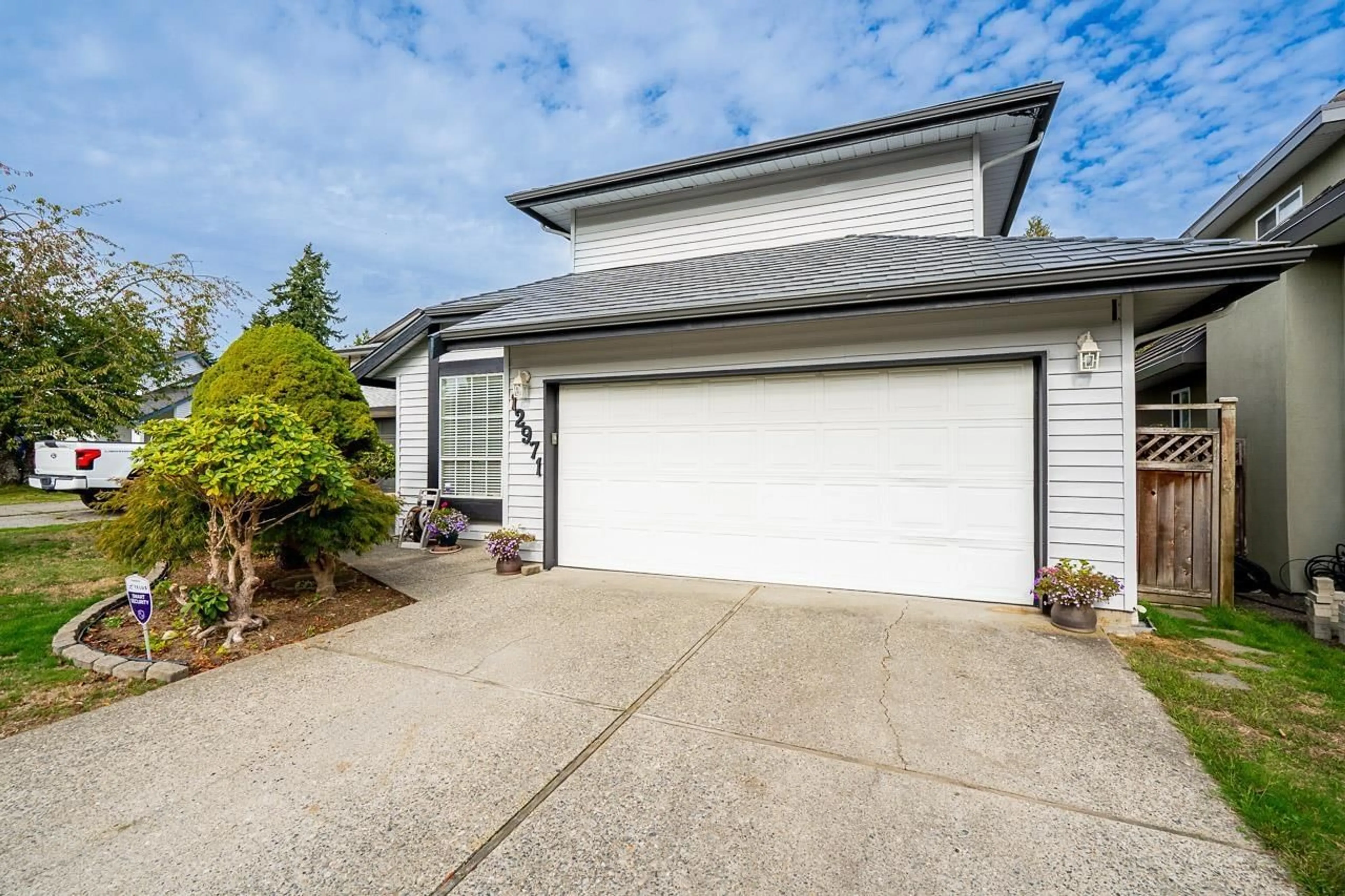 Home with vinyl exterior material, street for 12971 66B AVENUE, Surrey British Columbia V3W9P2