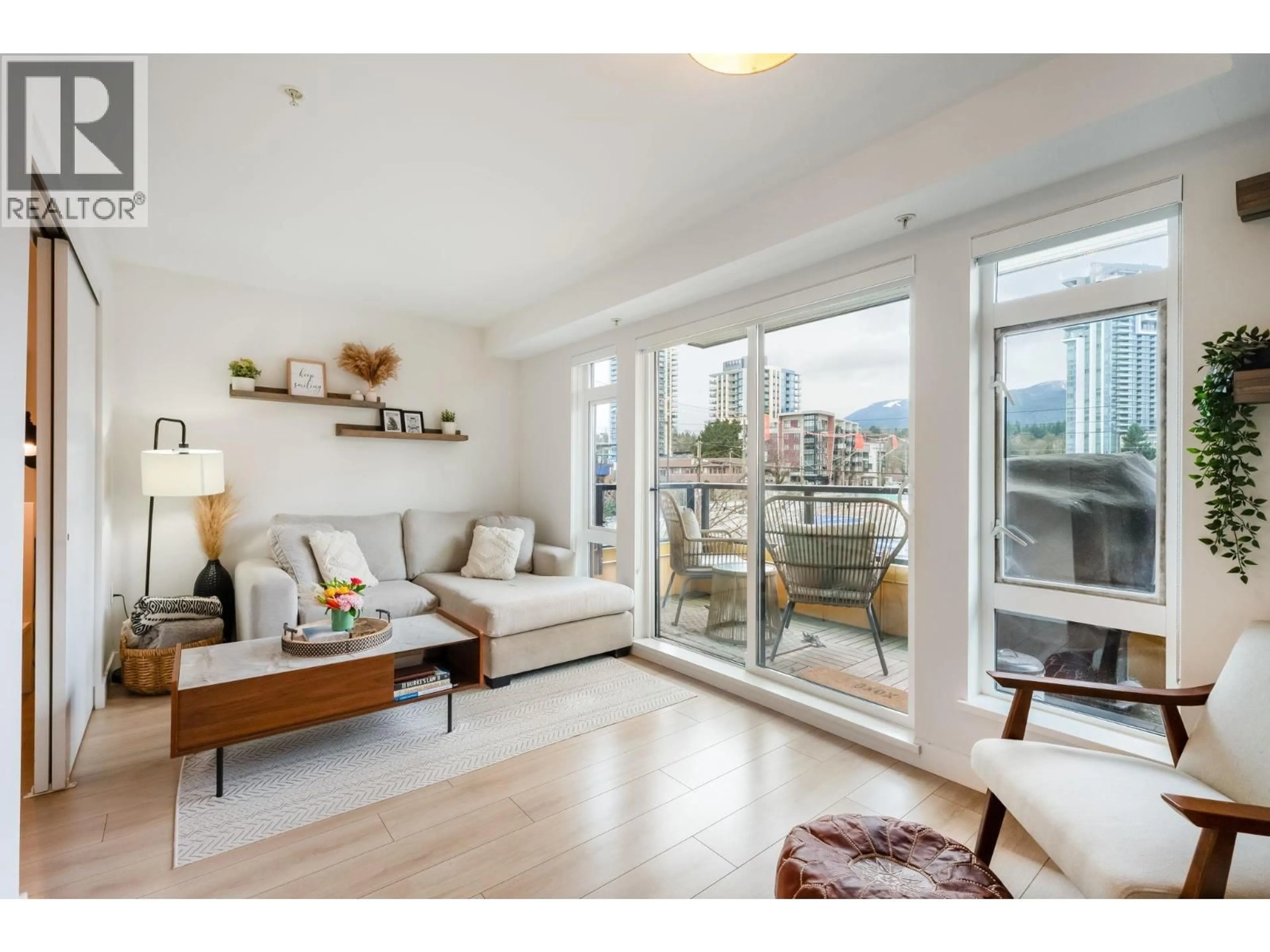 Living room with furniture, wood/laminate floor for 201 - 1519 CROWN STREET, North Vancouver British Columbia V7J1G6