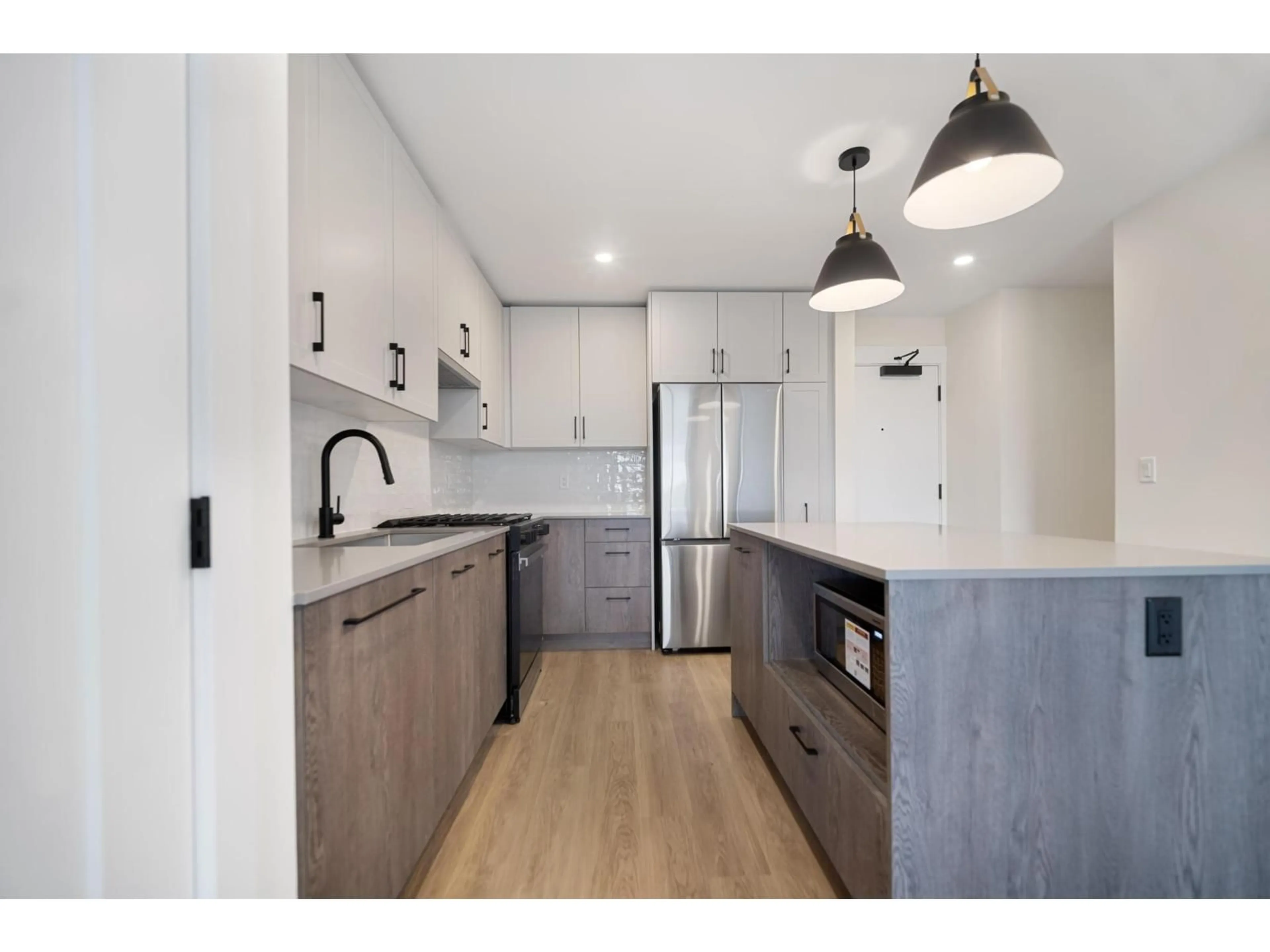 Open concept kitchen, unknown for 503 - 27215 ALDERGROVE TOWN CENTRE DRIVE, Langley British Columbia V4W0E3