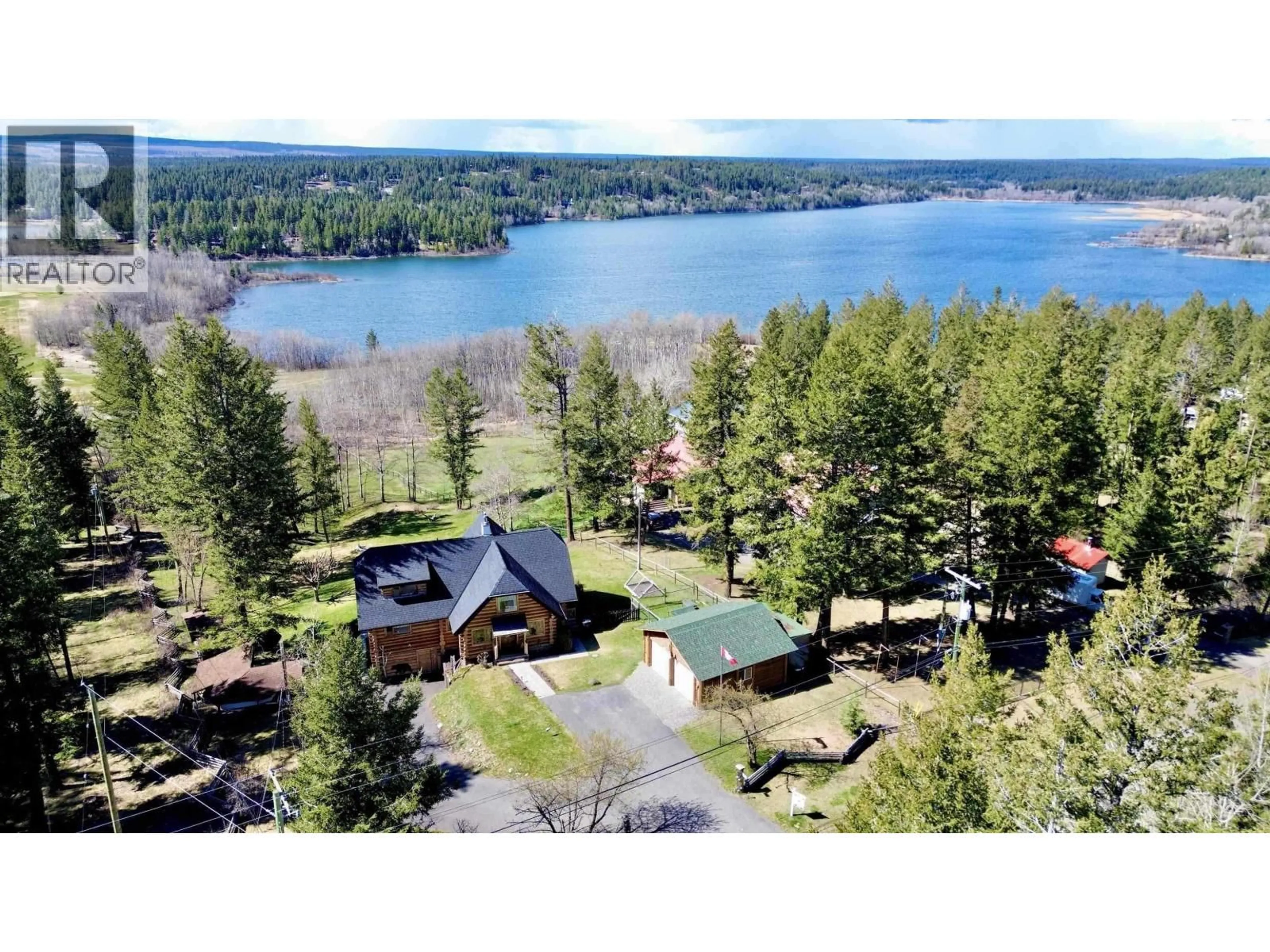 A pic from outside/outdoor area/front of a property/back of a property/a pic from drone, water/lake/river/ocean view for 4768 TELQUA DRIVE, 108 Mile Ranch British Columbia V0K2Z0