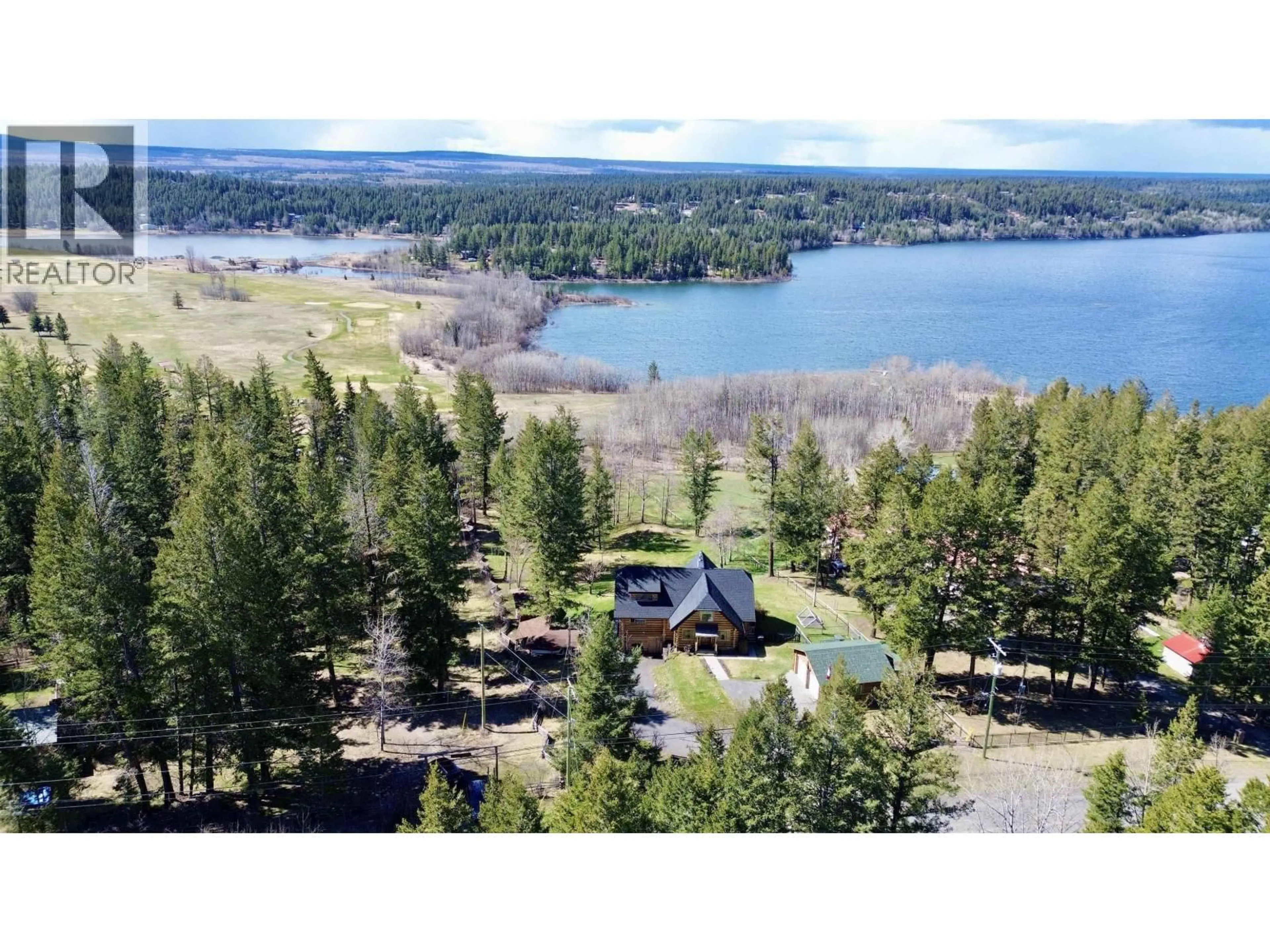 A pic from outside/outdoor area/front of a property/back of a property/a pic from drone, water/lake/river/ocean view for 4768 TELQUA DRIVE, 108 Mile Ranch British Columbia V0K2Z0