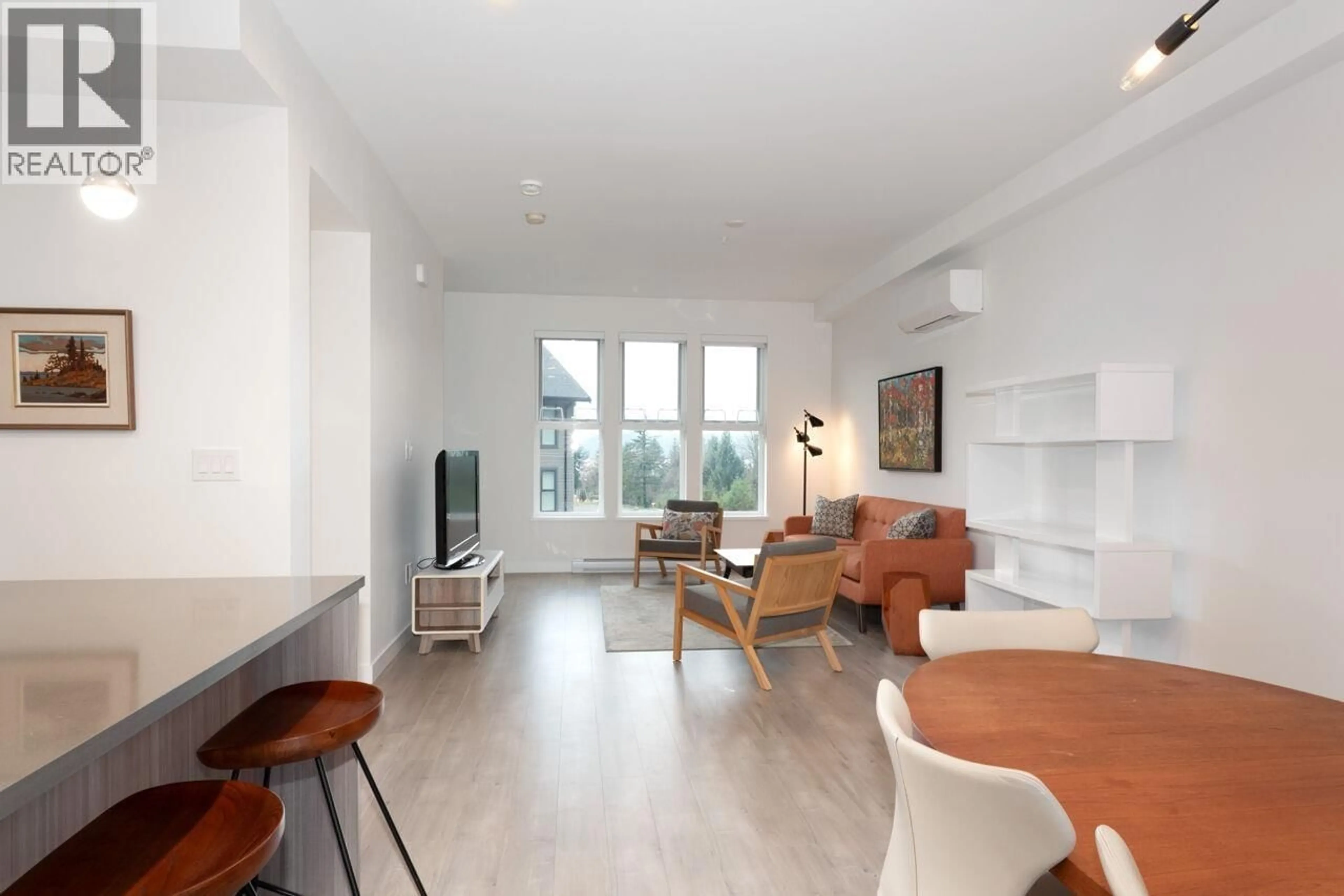 Living room with furniture, wood/laminate floor for 65 - 351 COPPER DRIVE, Britannia Beach British Columbia V8B1C5