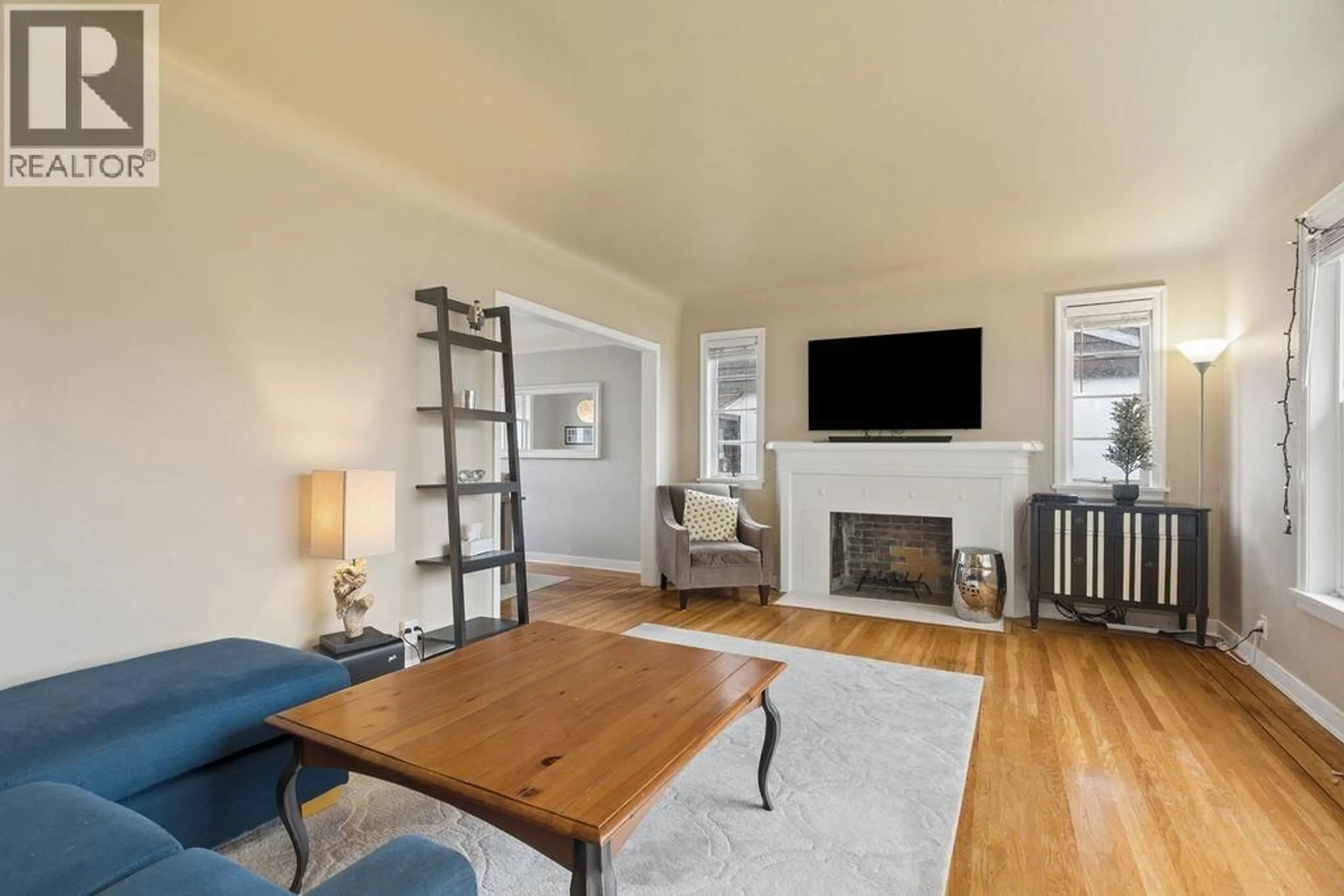 Living room with furniture, wood/laminate floor for 1810 TENTH AVENUE, New Westminster British Columbia V3M3J5