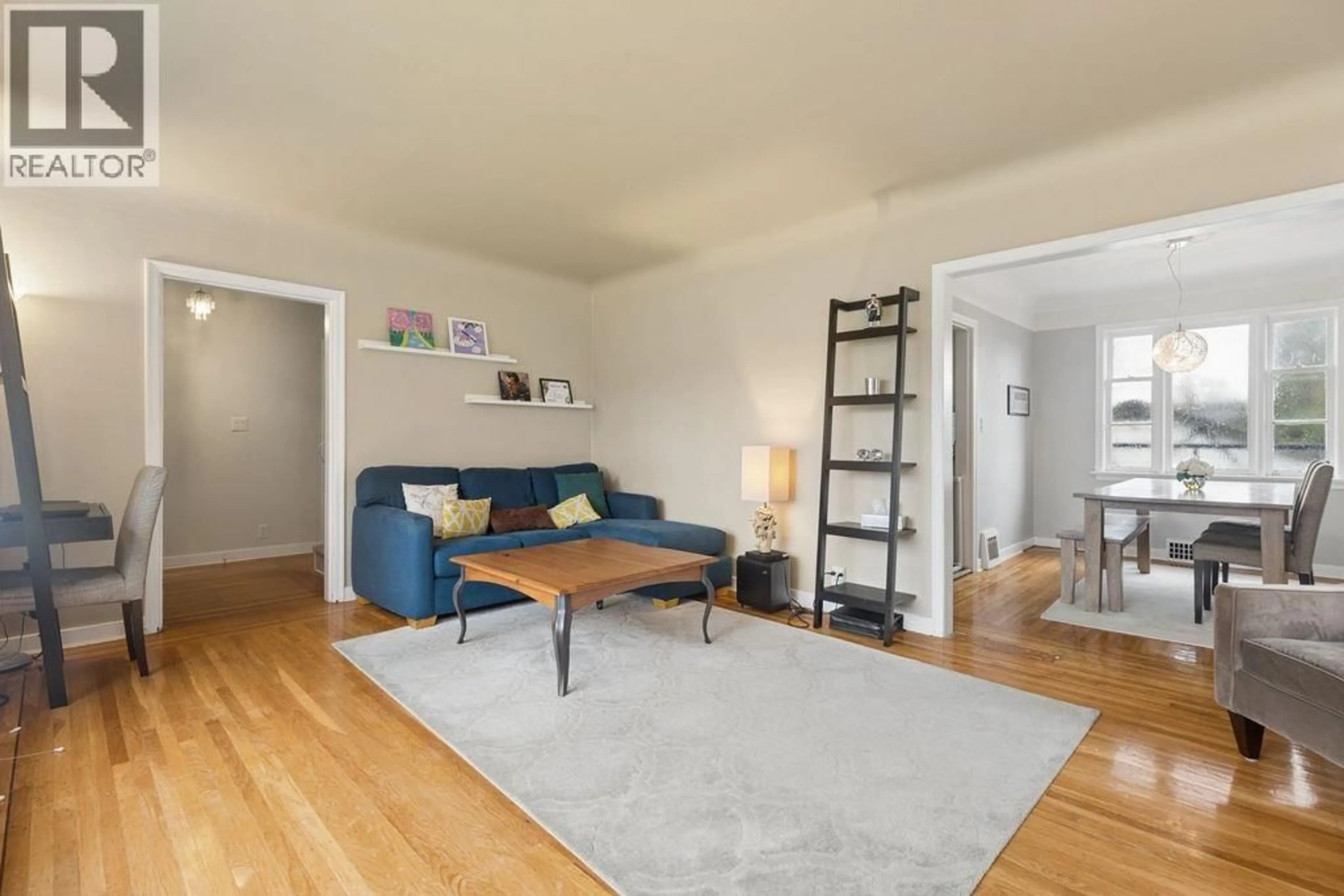 Living room with furniture, wood/laminate floor for 1810 TENTH AVENUE, New Westminster British Columbia V3M3J5