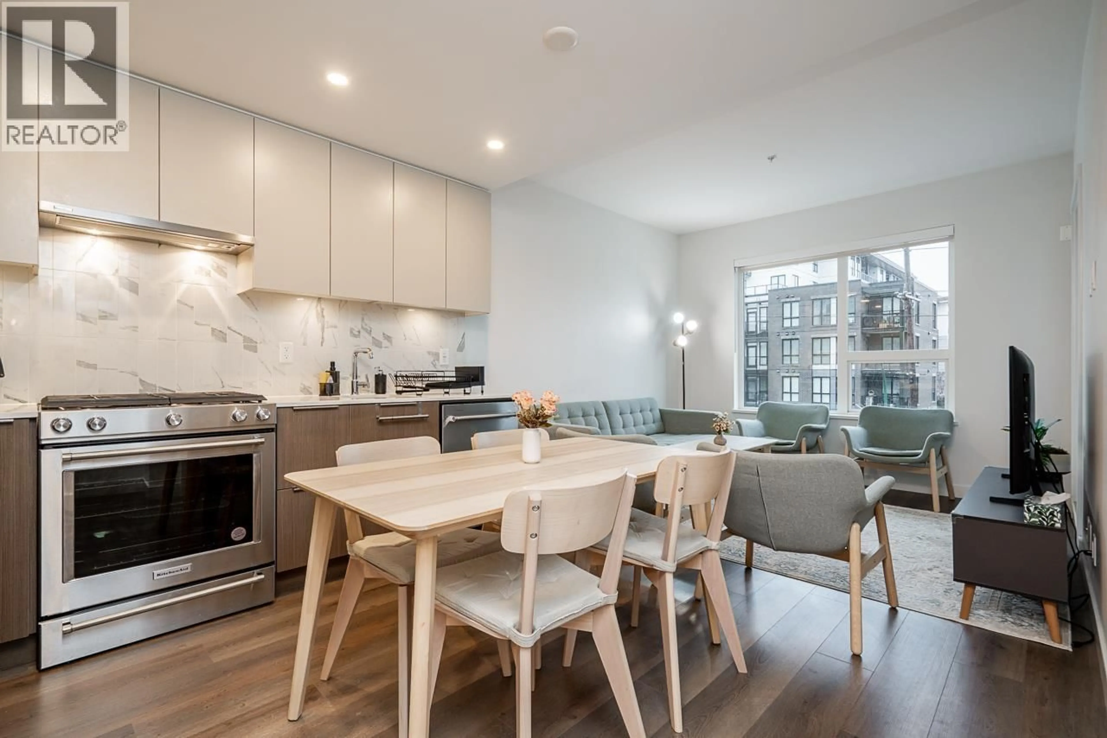 Open concept kitchen, wood/laminate floor for 308 - 645 COMO LAKE AVENUE, Coquitlam British Columbia V3J0N9