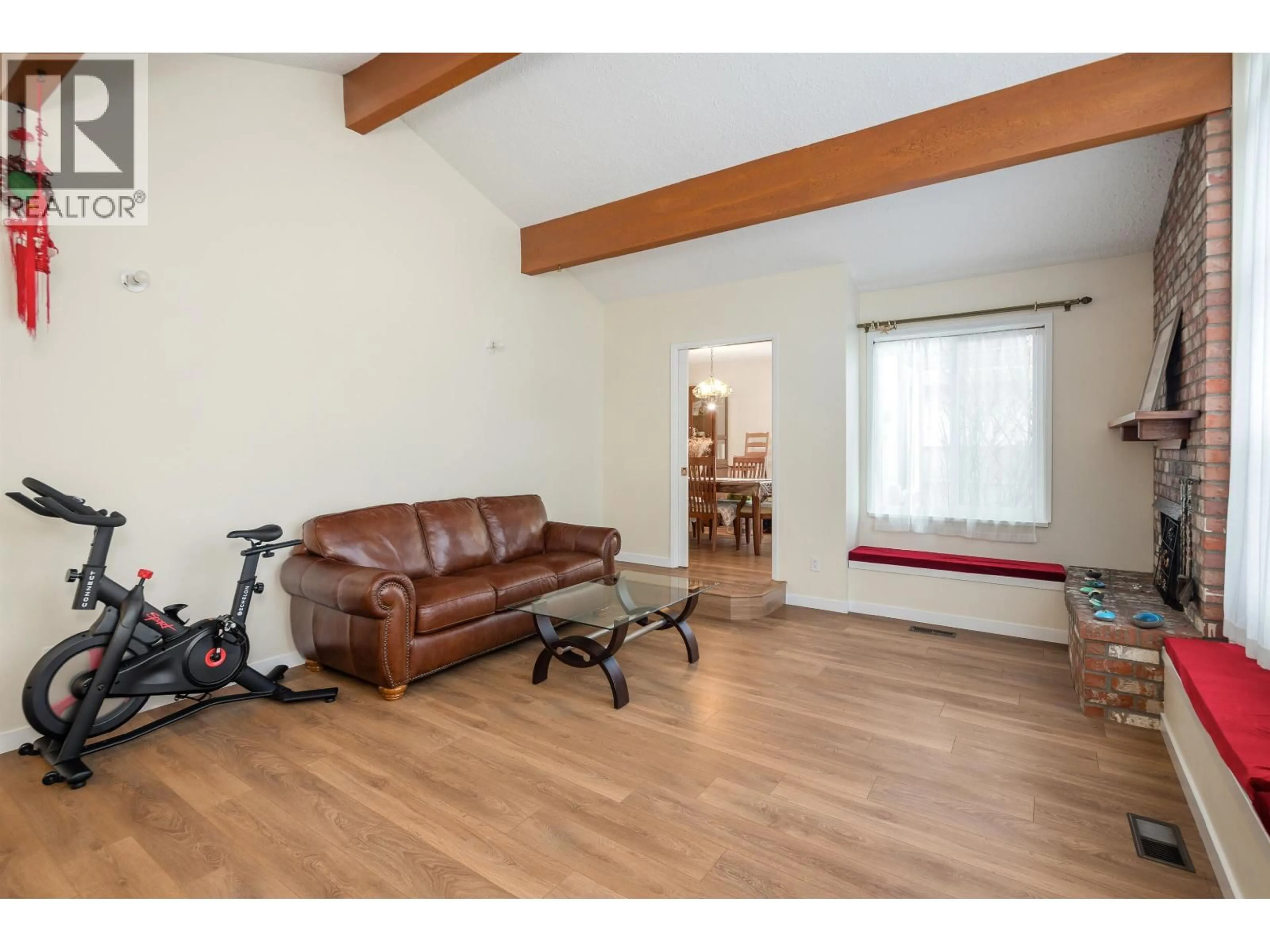 Living room with furniture, wood/laminate floor for 7720 NO. 1 ROAD, Richmond British Columbia V7C1T6