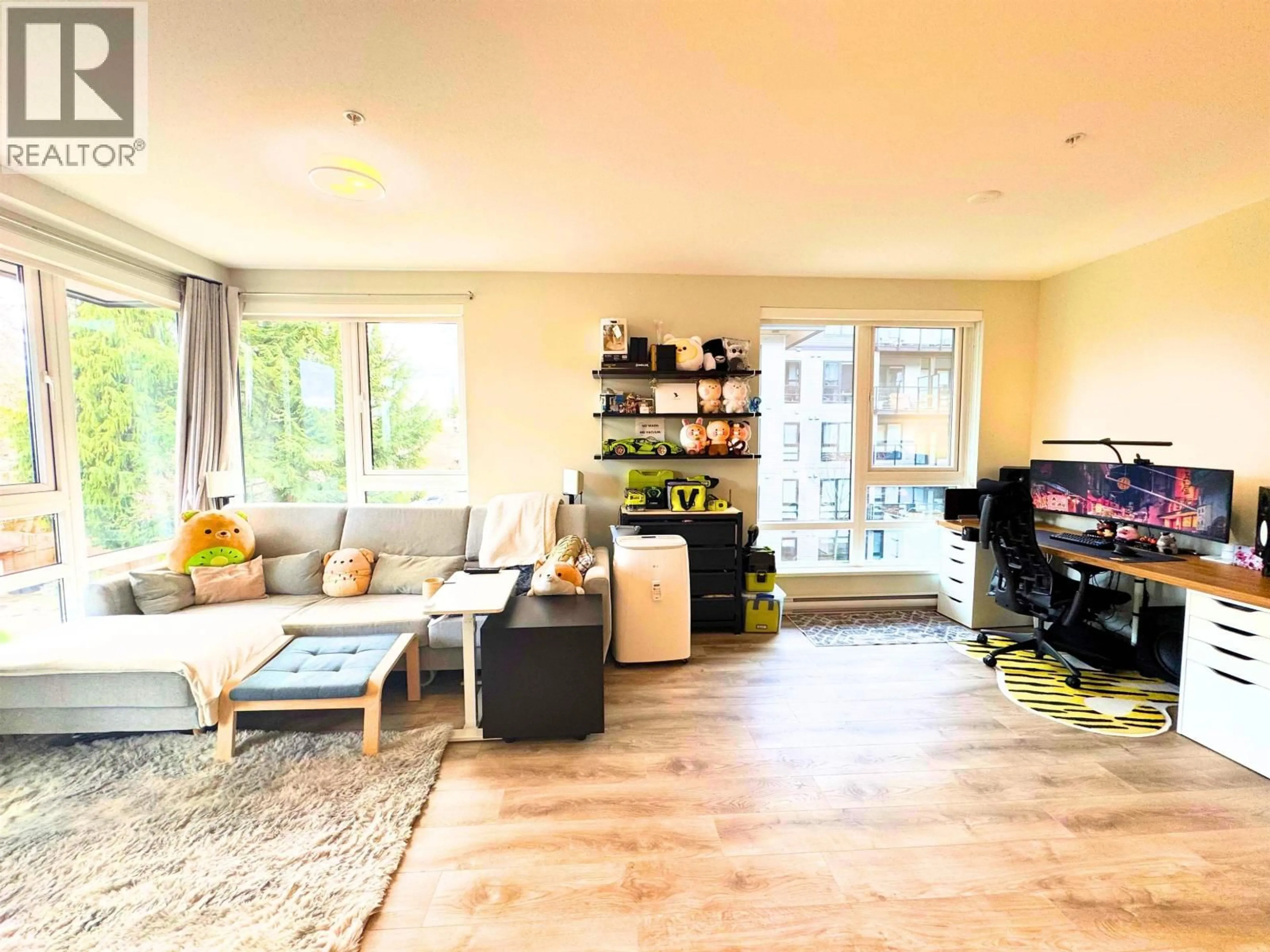 Living room with furniture, wood/laminate floor for 420 - 615 COTTONWOOD AVENUE, Coquitlam British Columbia V3J2S5