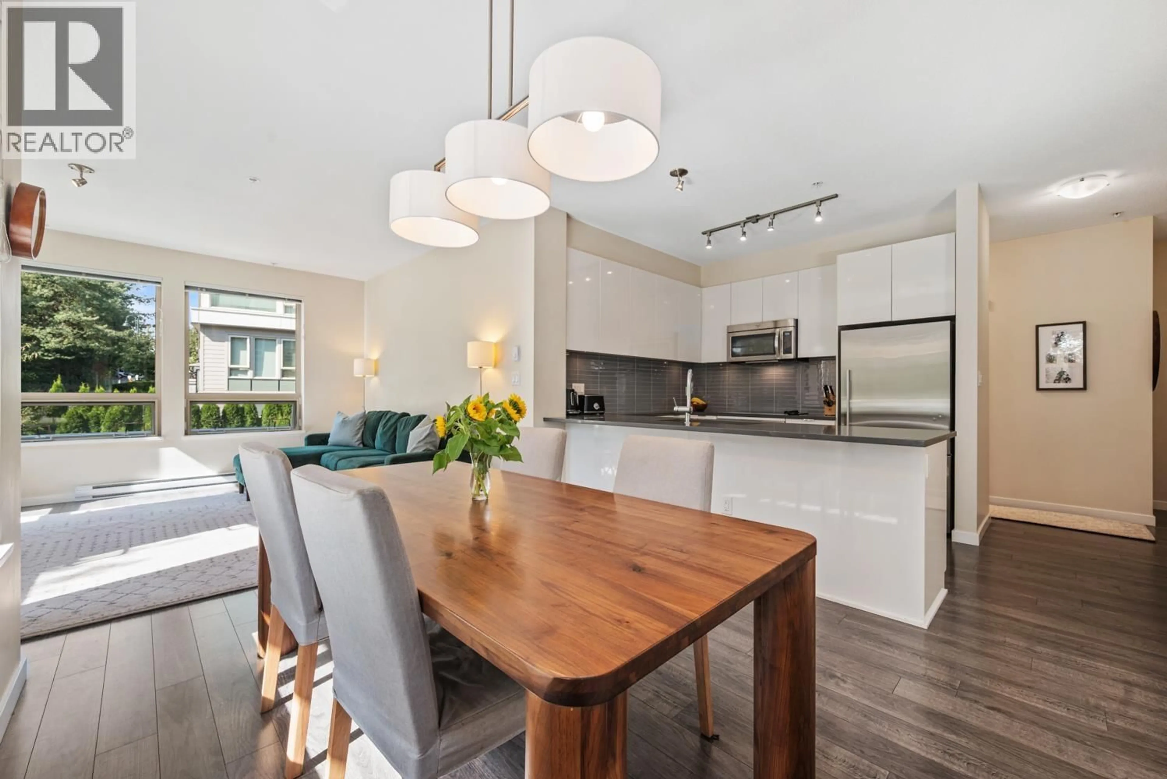 Open concept kitchen, wood/laminate floor for 206 - 2665 MOUNTAIN HIGHWAY, North Vancouver British Columbia V7J0A8
