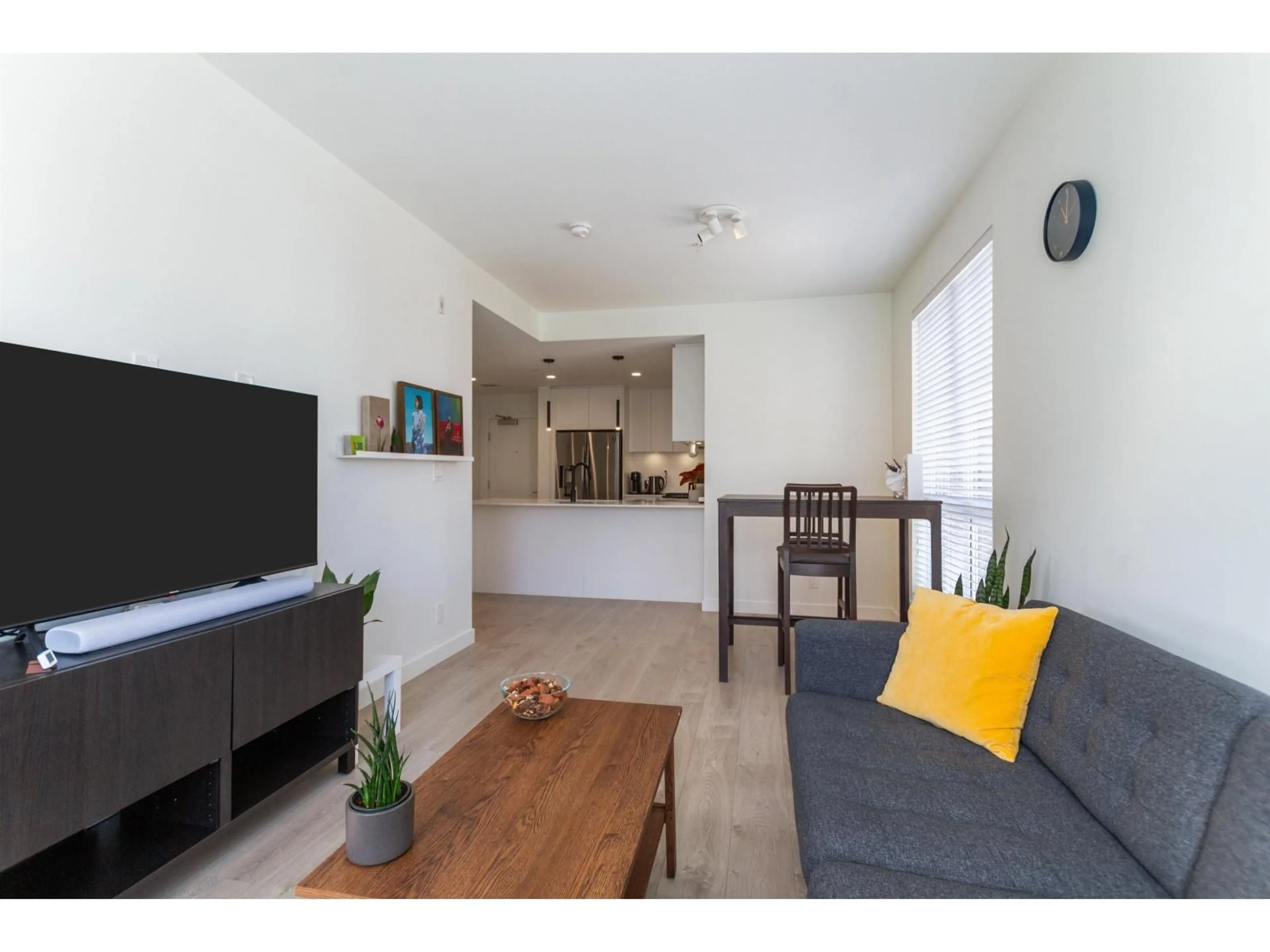 Living room with furniture, wood/laminate floor for B308 - 20018 83A AVENUE, Langley British Columbia V2Y3P3