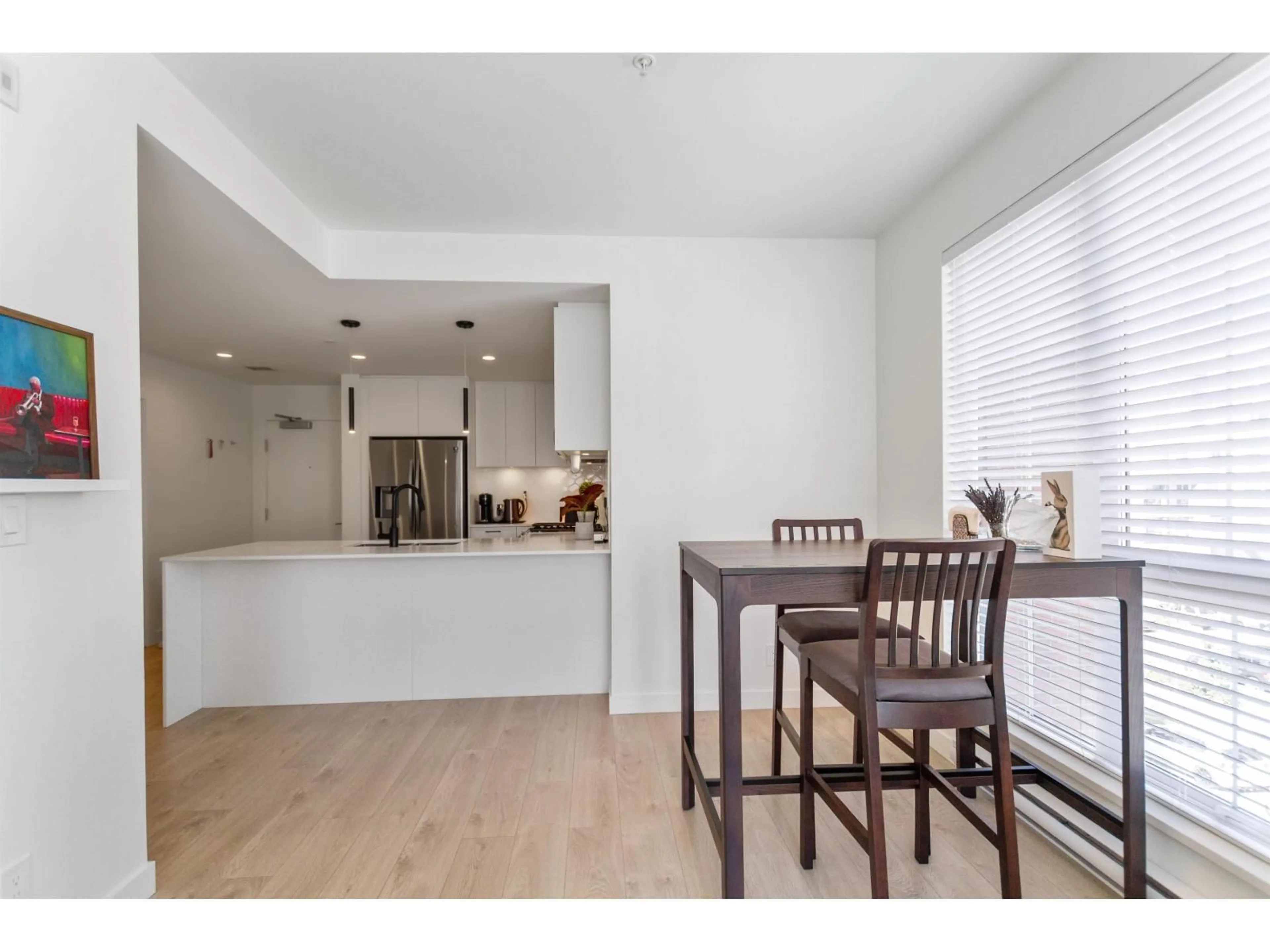 Open concept kitchen, wood/laminate floor for B308 - 20018 83A AVENUE, Langley British Columbia V2Y3P3