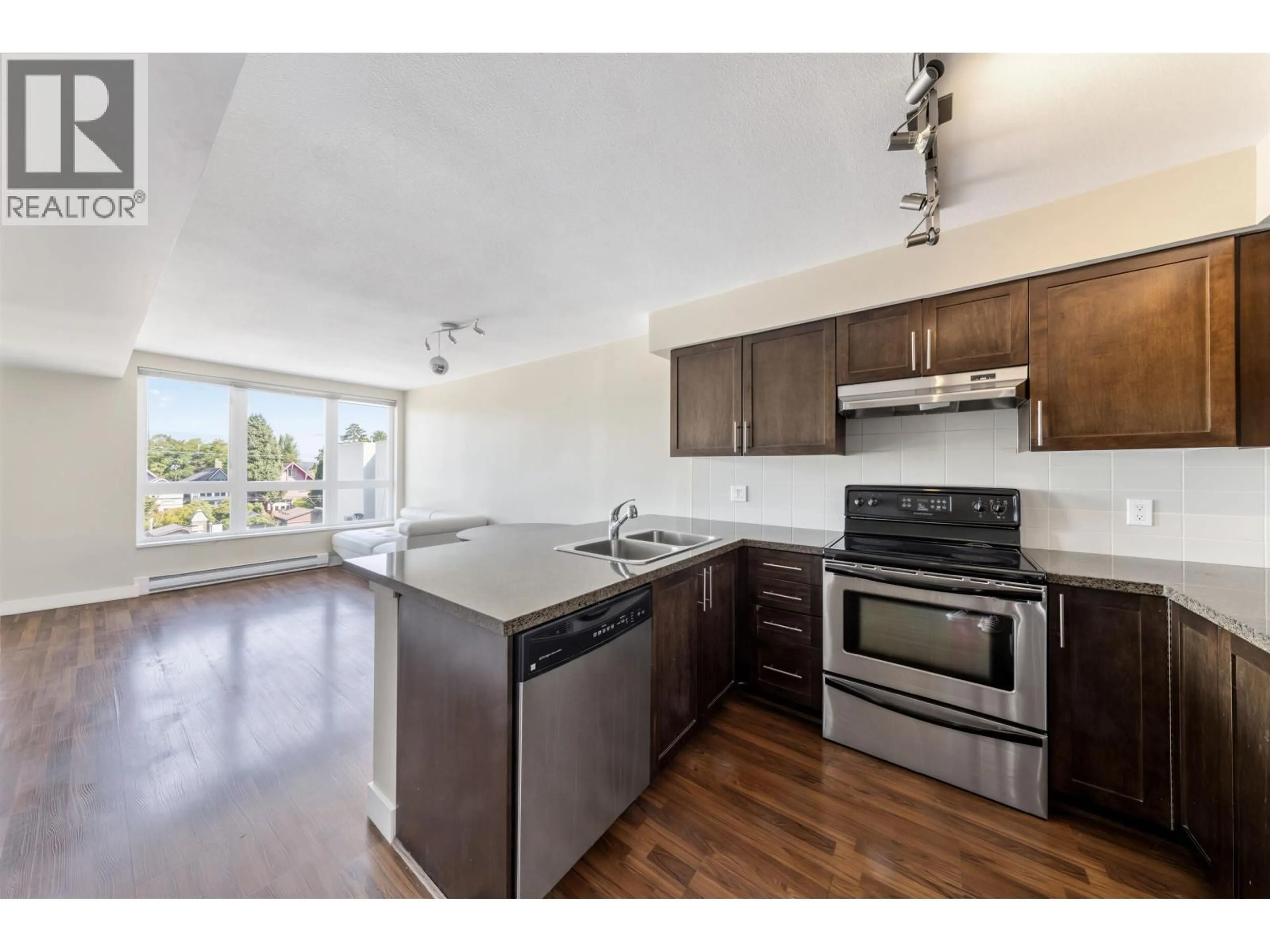 Open concept kitchen, wood/laminate floor for 306 - 2008 BAYSWATER STREET, Vancouver British Columbia V6K4A8