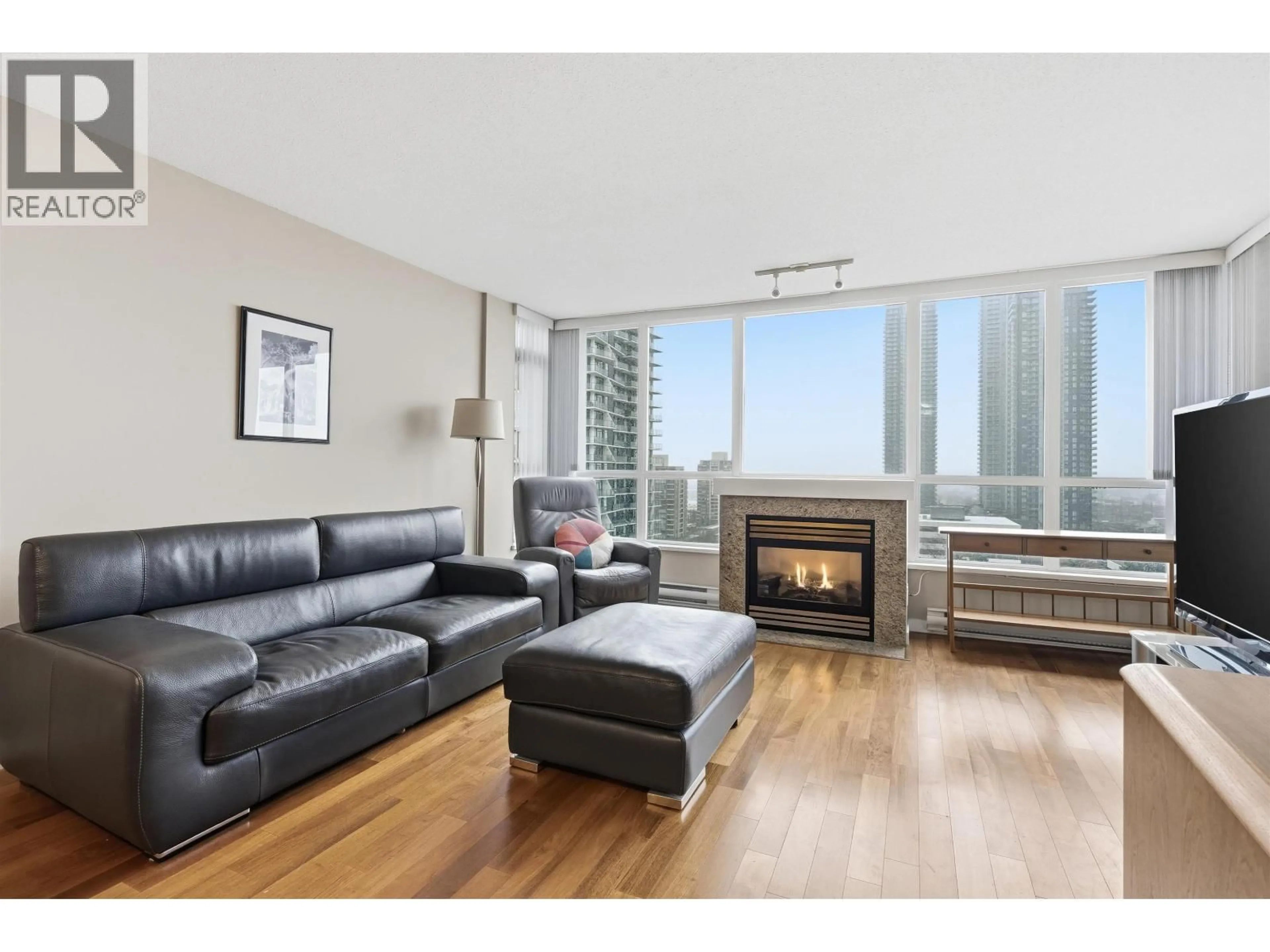 Living room with furniture, wood/laminate floor for 1504 - 2138 MADISON AVENUE, Burnaby British Columbia V5C6T6