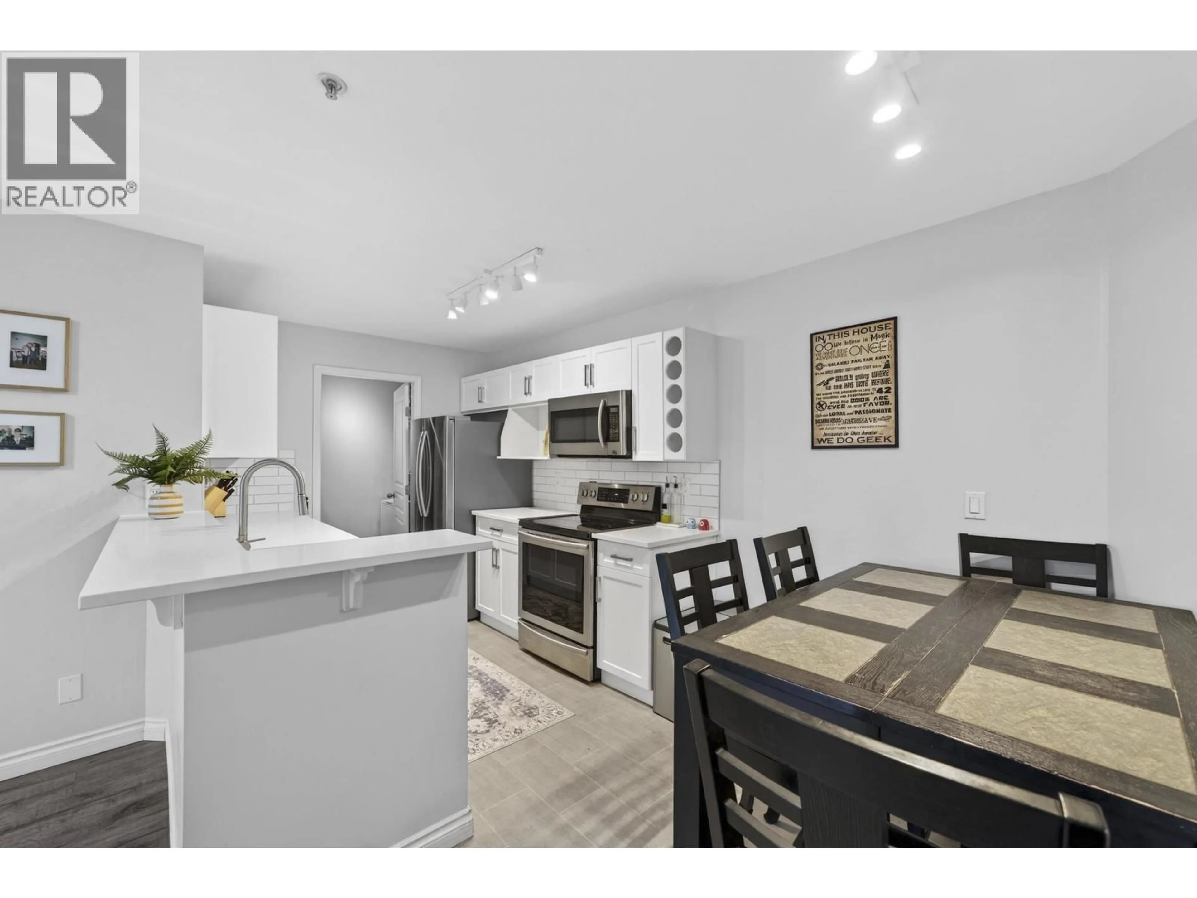 Open concept kitchen, wood/laminate floor for 213 - 7139 18TH AVENUE, Burnaby British Columbia V3N4Z3