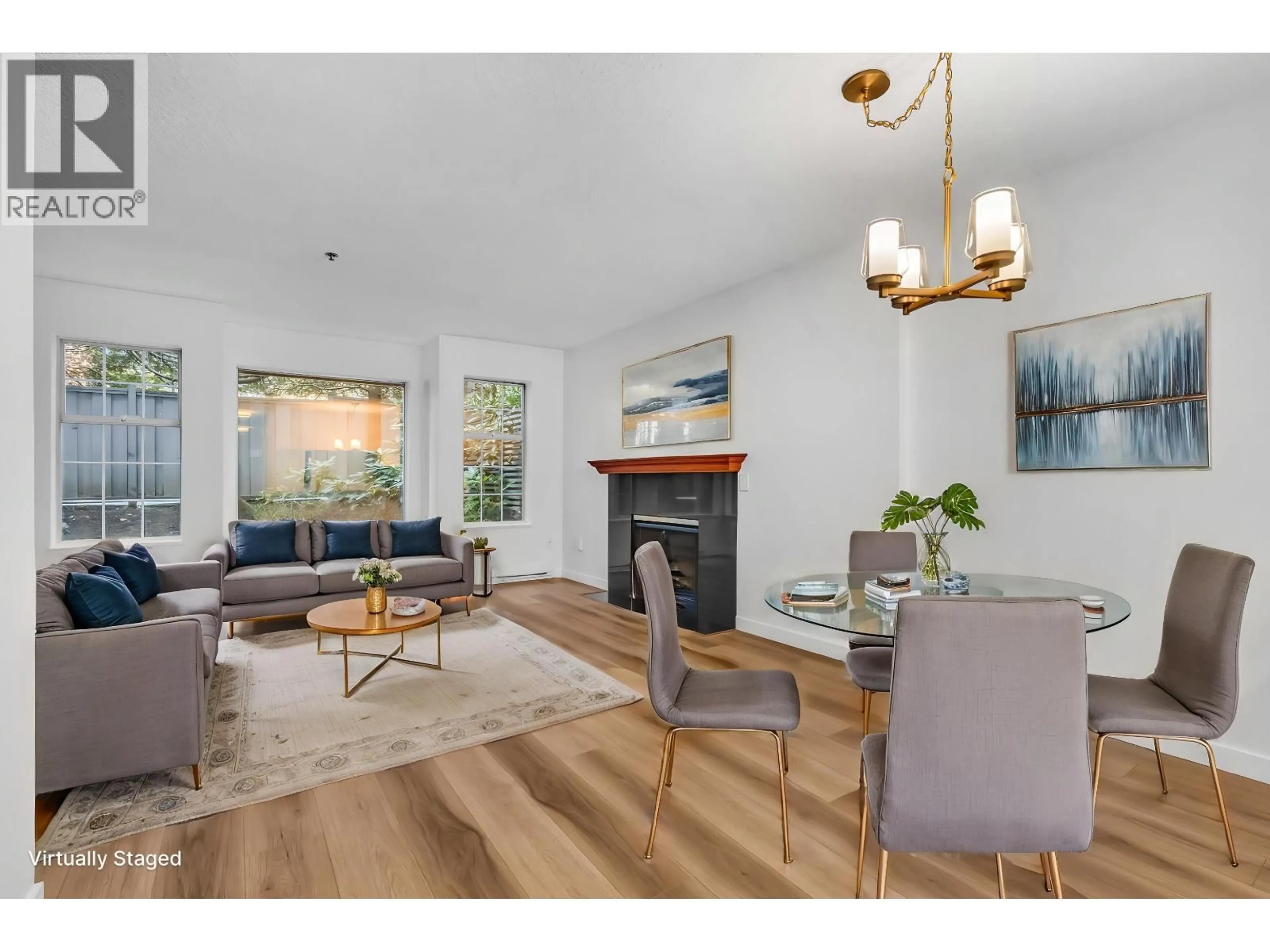 Living room with furniture, wood/laminate floor for 101 - 735 15 AVENUE, Vancouver British Columbia V5Z1R6