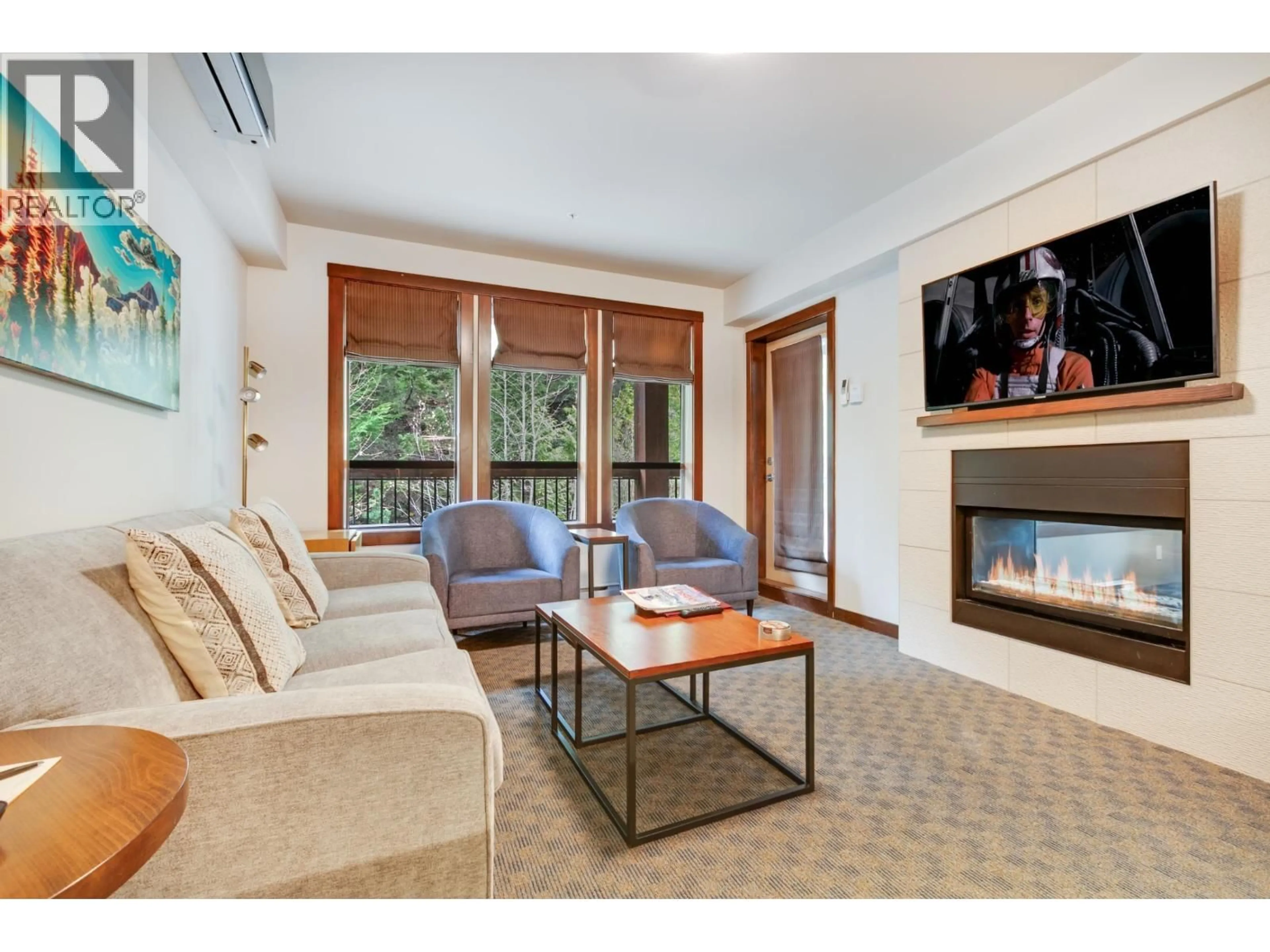 Living room with furniture, wood/laminate floor for 301B - 2020 LONDON LANE, Whistler British Columbia V0N1B2