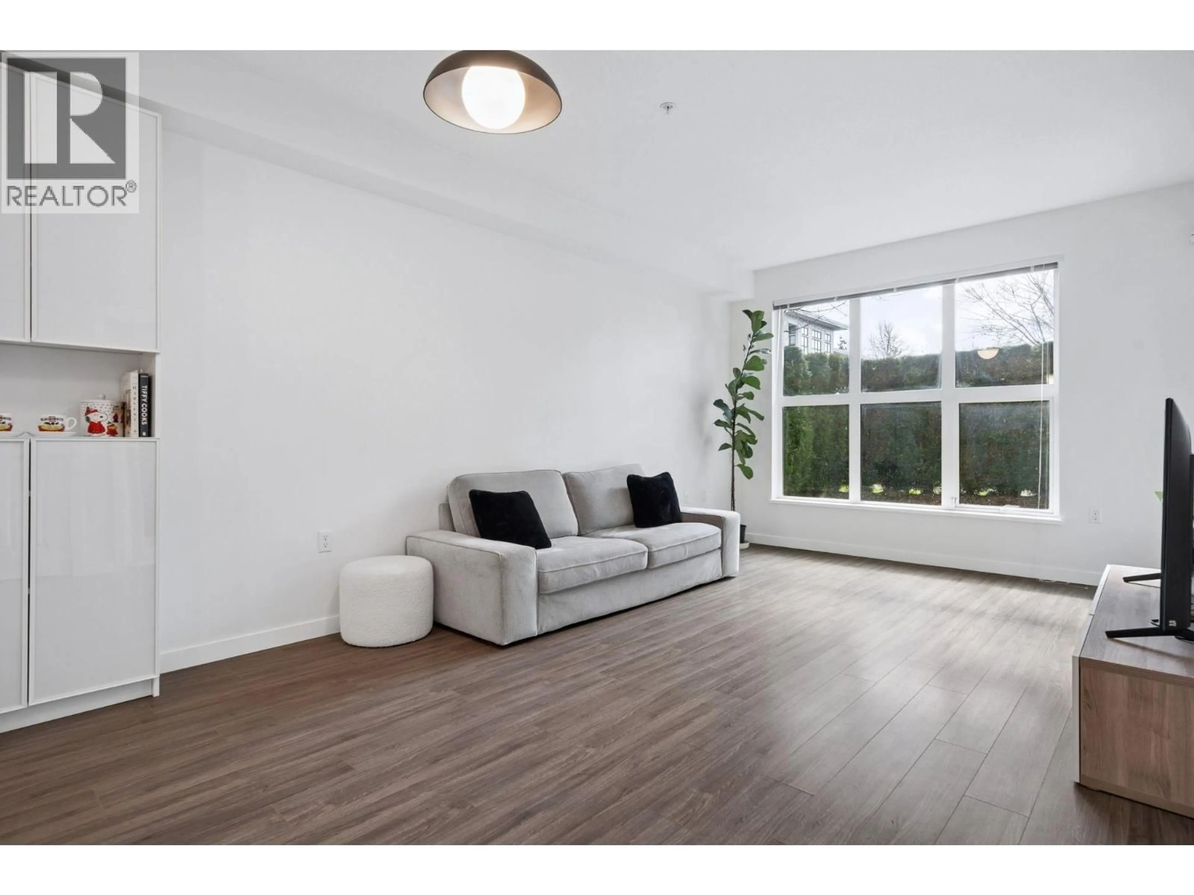 Living room with furniture, wood/laminate floor for 121 - 9500 TOMICKI AVENUE, Richmond British Columbia V6X0R9