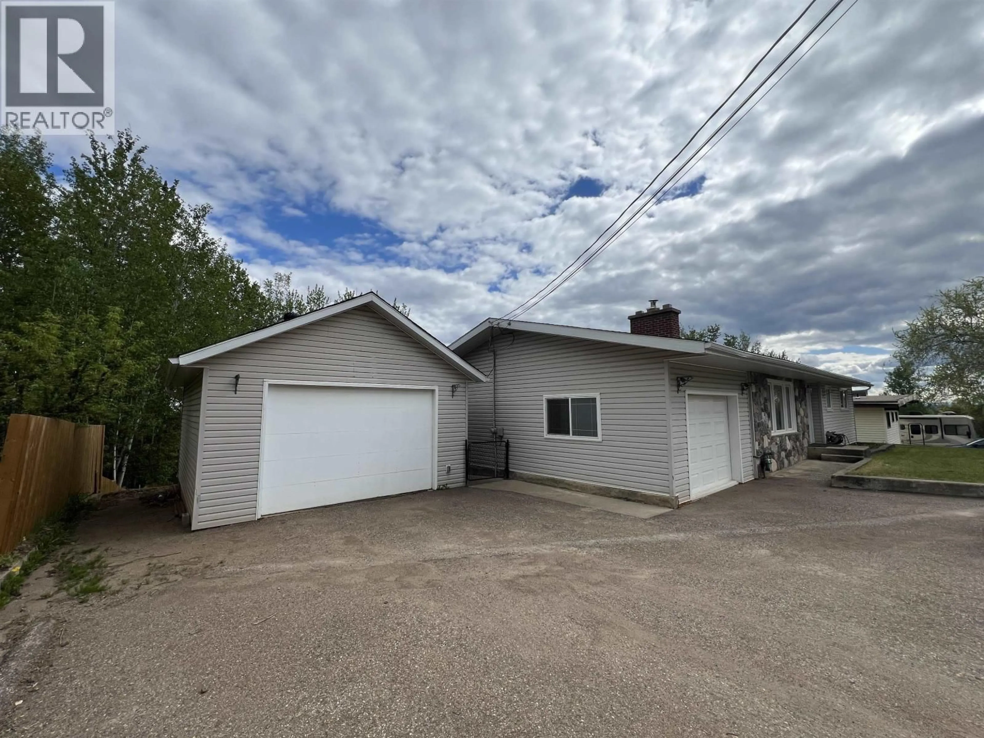 A pic from outside/outdoor area/front of a property/back of a property/a pic from drone, building for 5324 51 STREET, Fort Nelson British Columbia V0C1R0