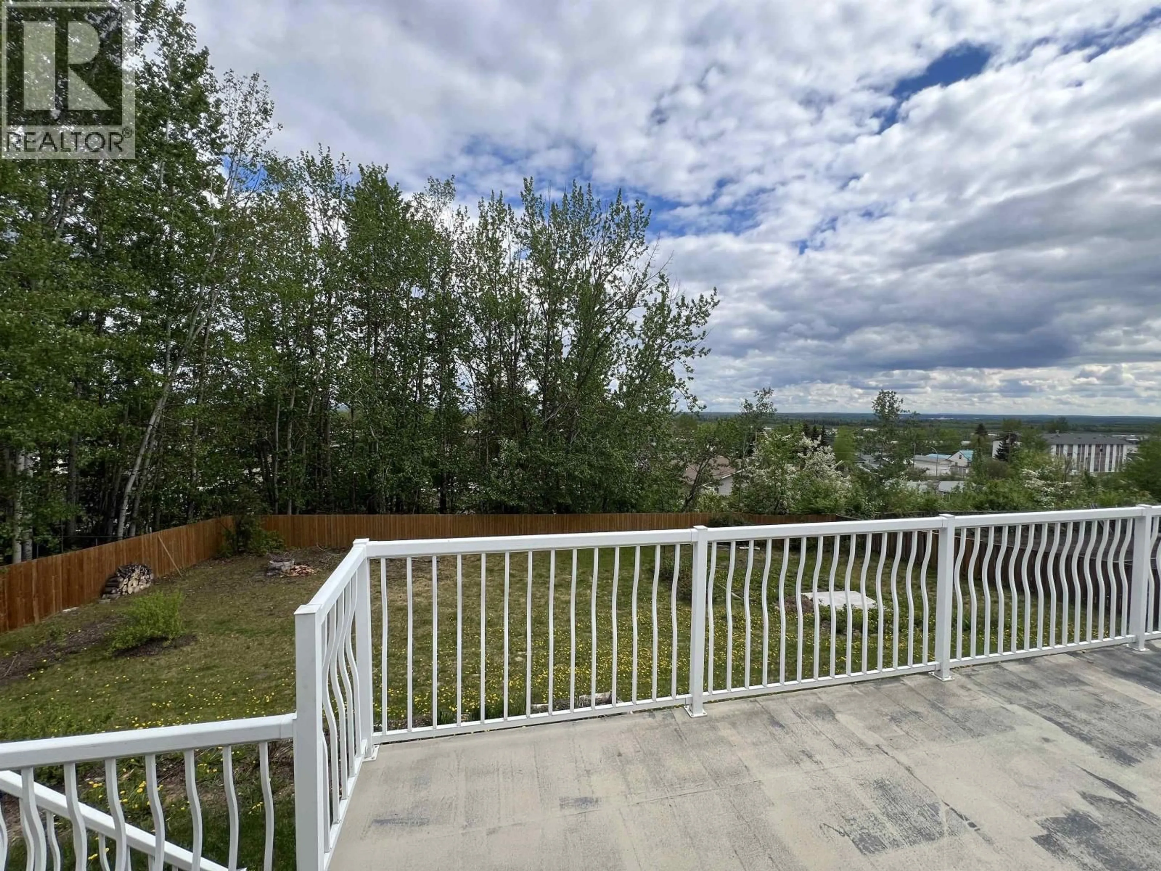 A pic from outside/outdoor area/front of a property/back of a property/a pic from drone, water/lake/river/ocean view for 5324 51 STREET, Fort Nelson British Columbia V0C1R0