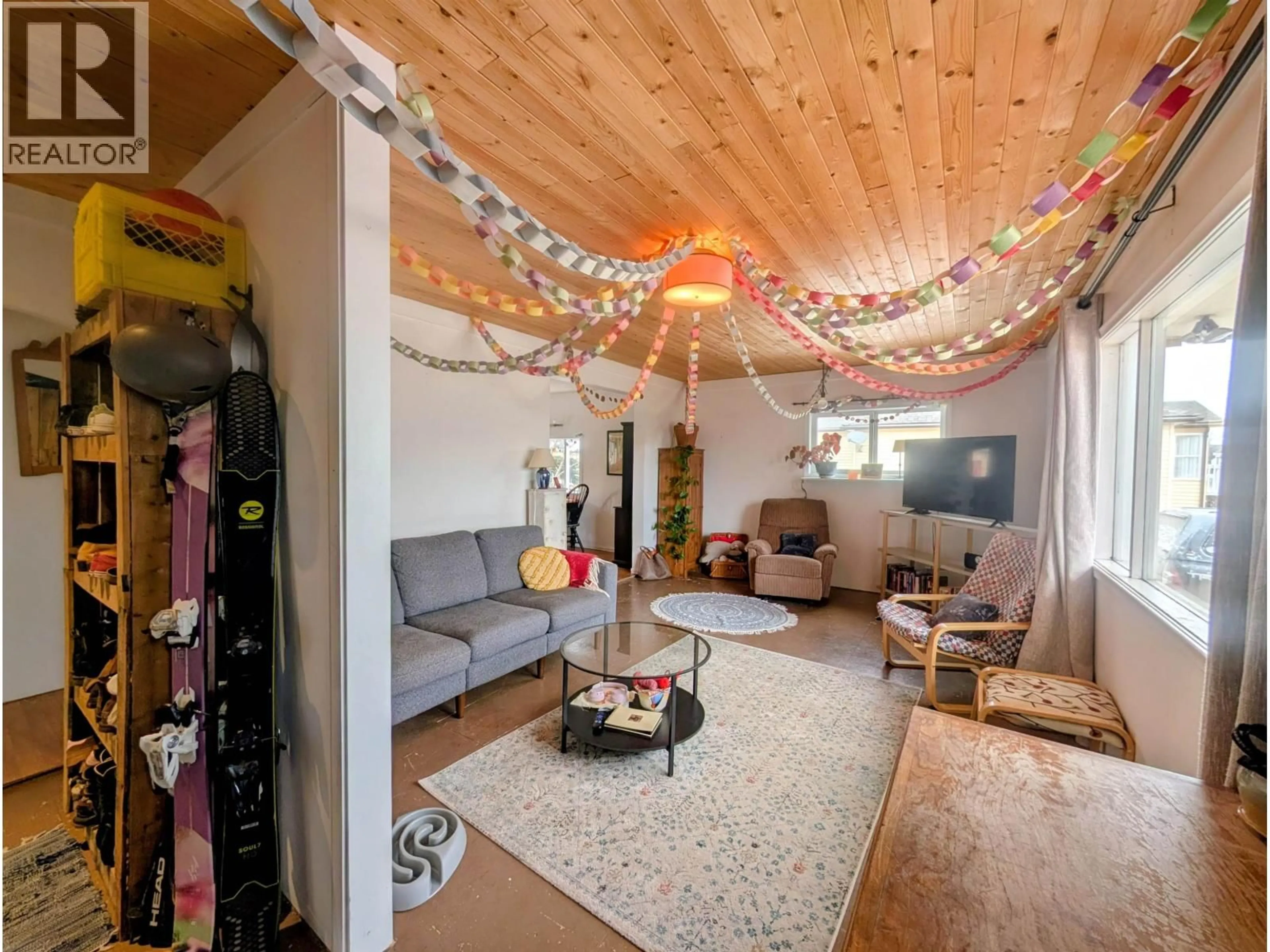 Living room with furniture, wood/laminate floor for 3679 BROADWAY AVENUE, Smithers British Columbia V0J2N0