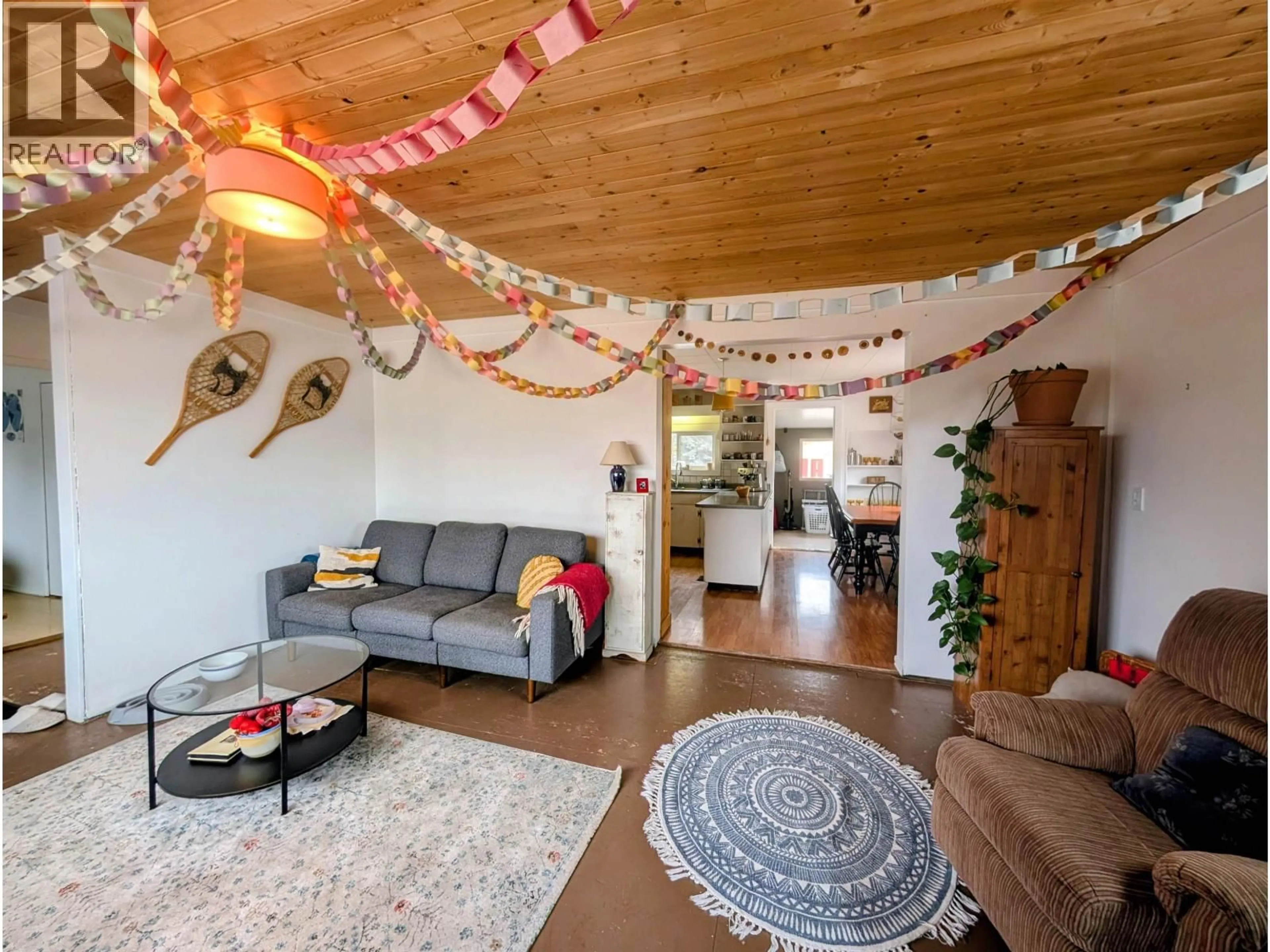 Living room with furniture, wood/laminate floor for 3679 BROADWAY AVENUE, Smithers British Columbia V0J2N0