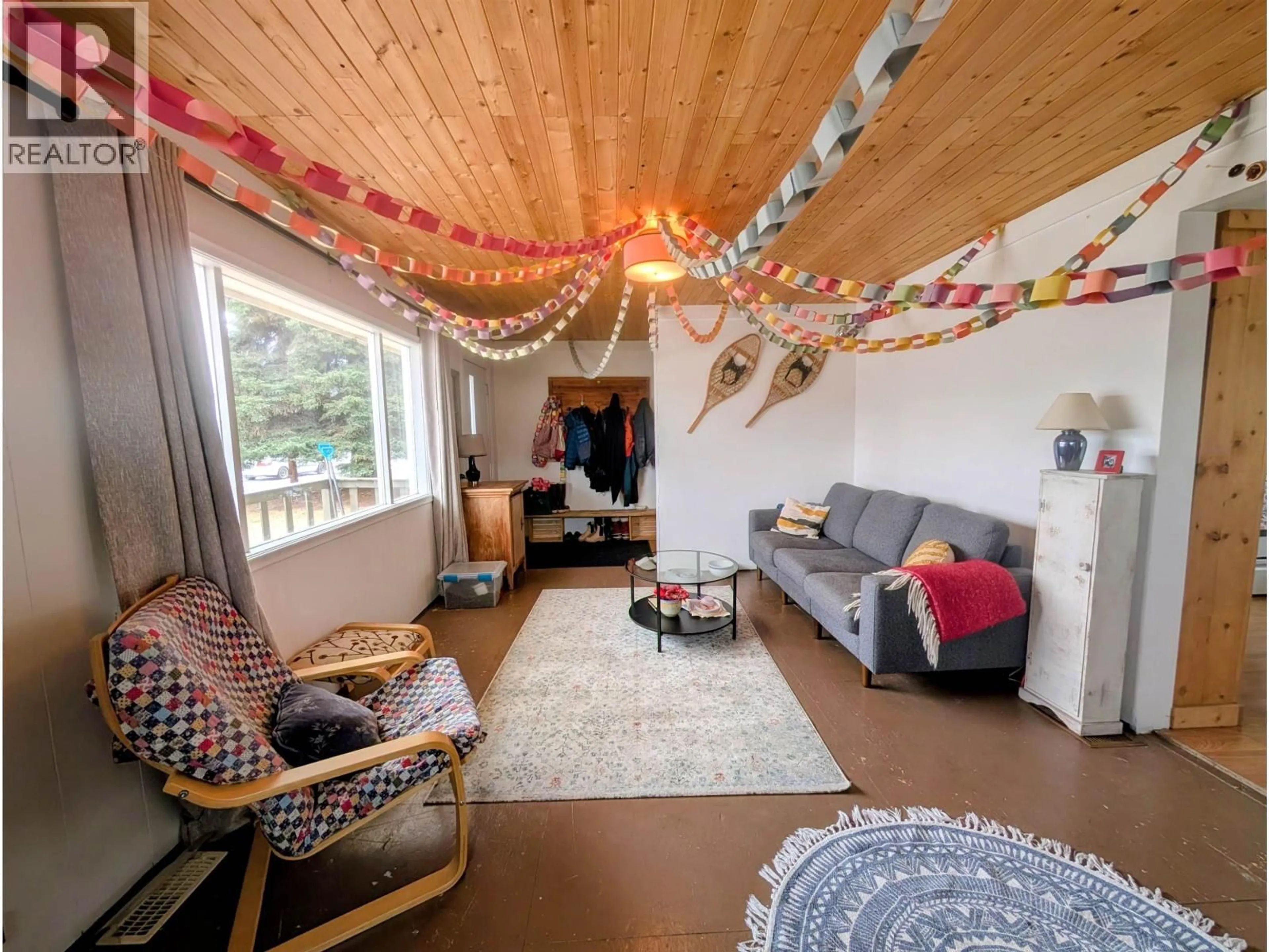 Living room with furniture, wood/laminate floor for 3679 BROADWAY AVENUE, Smithers British Columbia V0J2N0