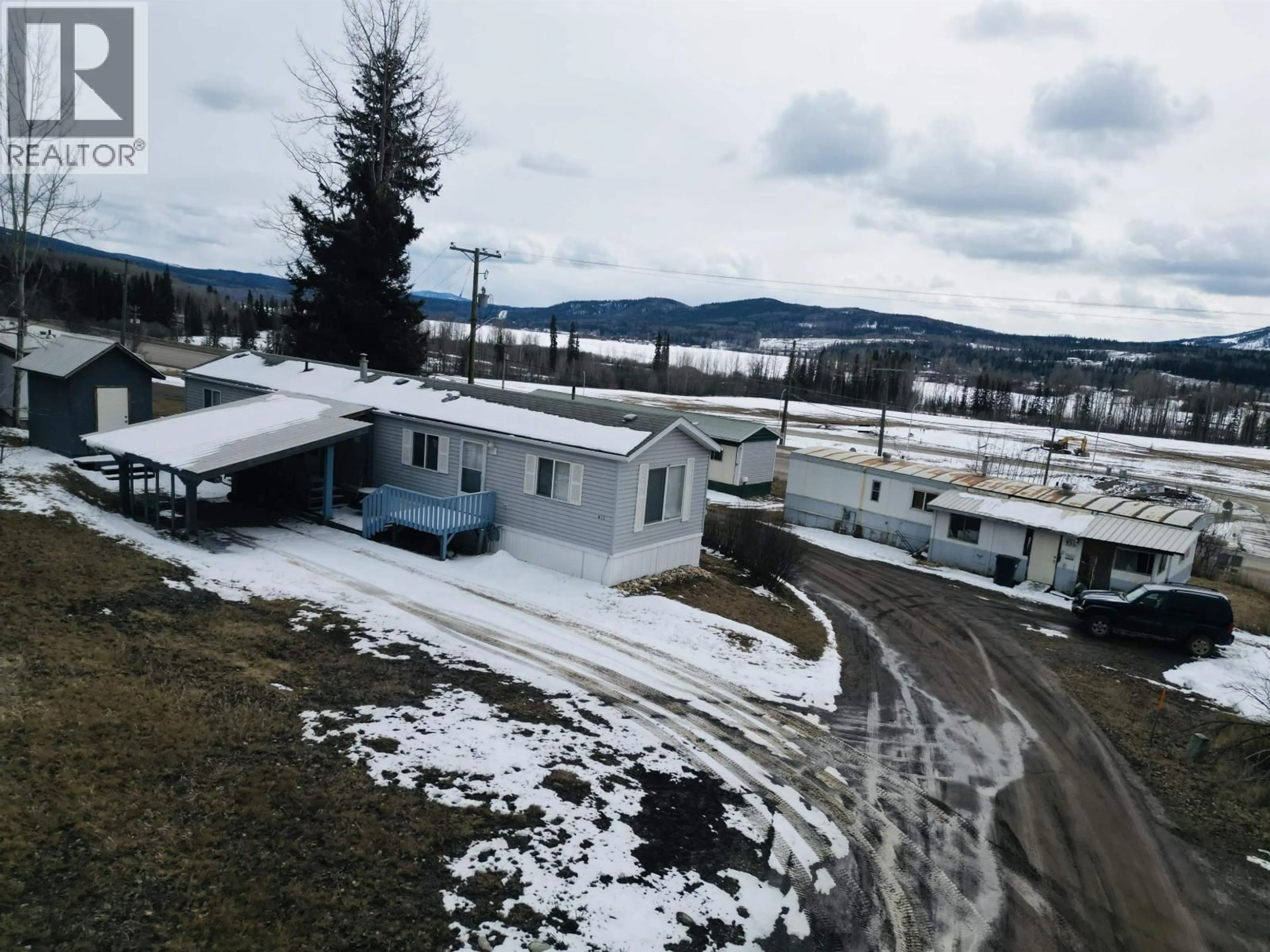 A pic from outside/outdoor area/front of a property/back of a property/a pic from drone, mountain view for B13 - 160 16 HIGHWAY, Burns Lake British Columbia V0J1E0