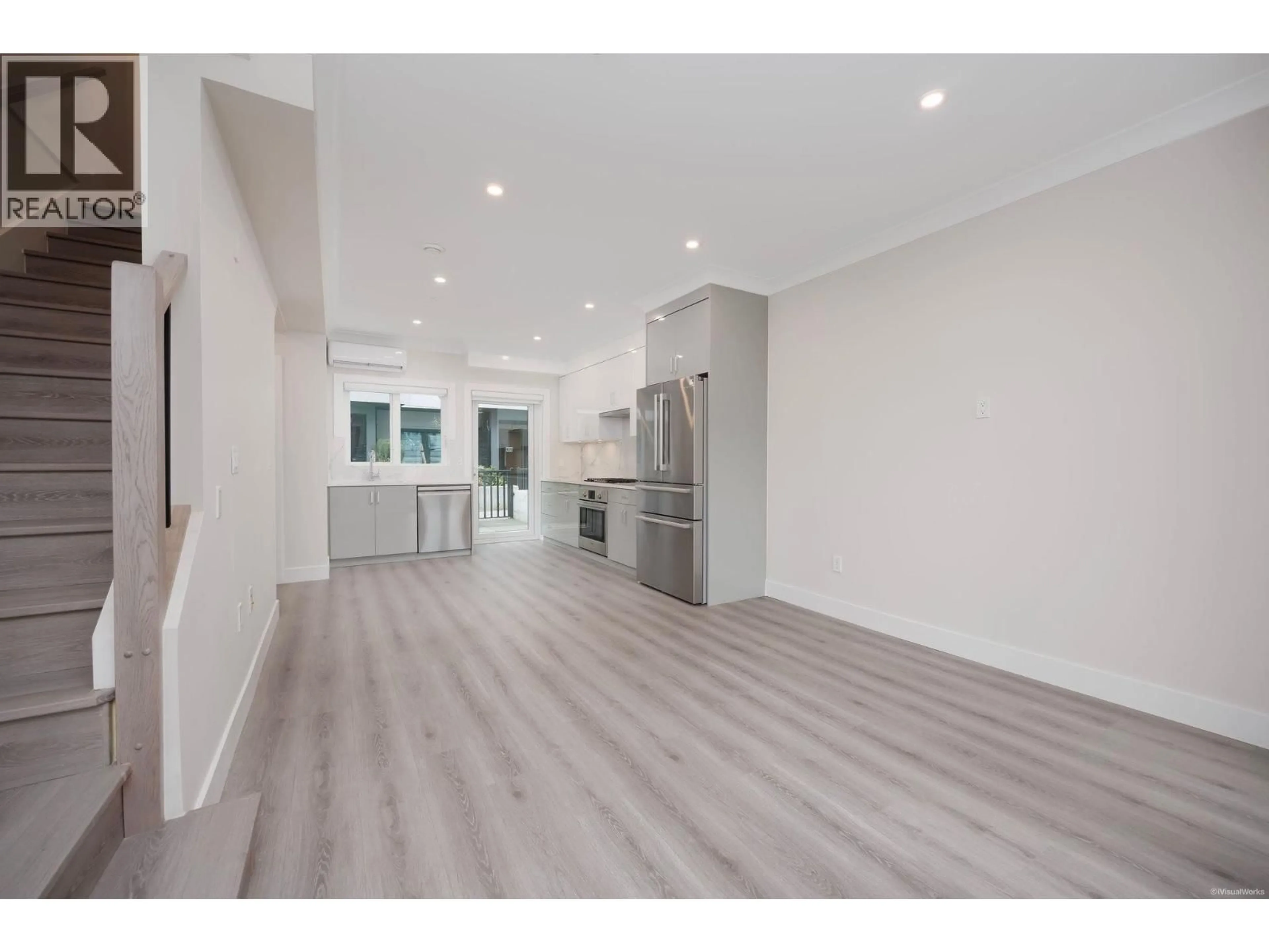 Open concept kitchen, wood/laminate floor for 8339 FRENCH STREET, Vancouver British Columbia V6P0L7