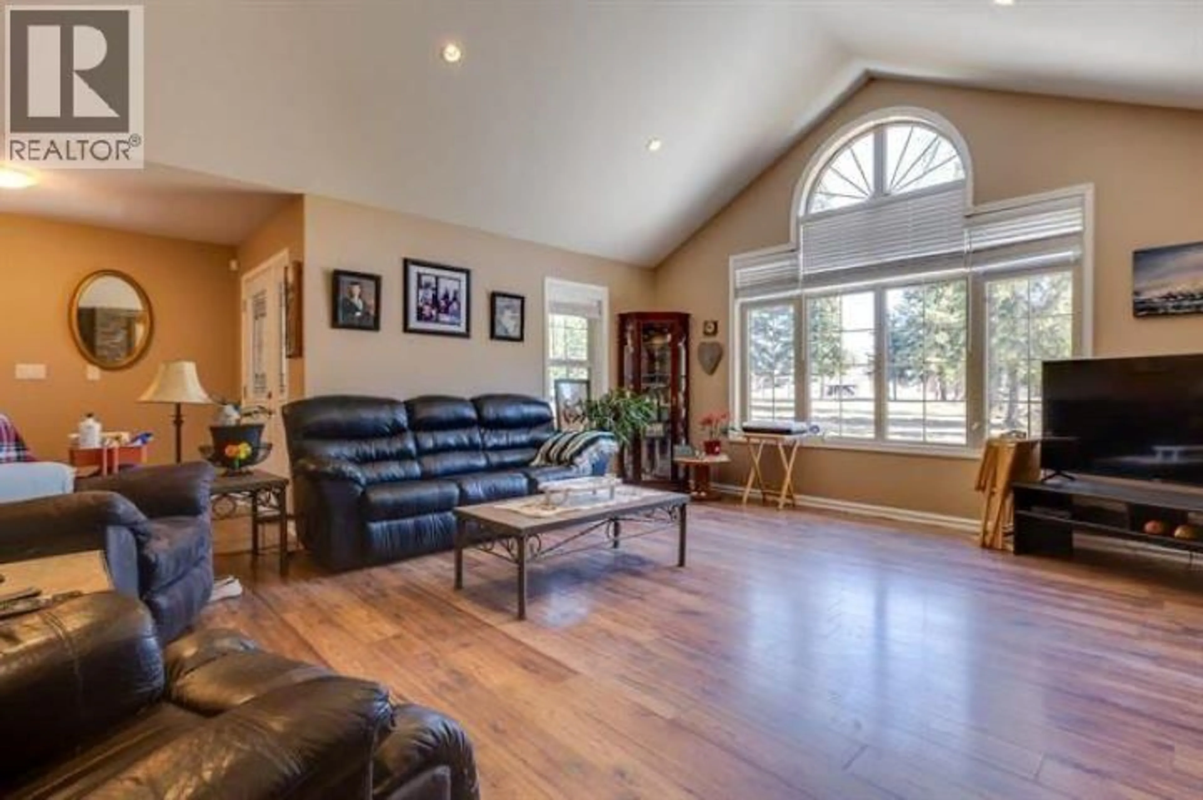 Living room with furniture, wood/laminate floor for 15055 CARIBOO HIGHWAY, Prince George British Columbia V2N5X7