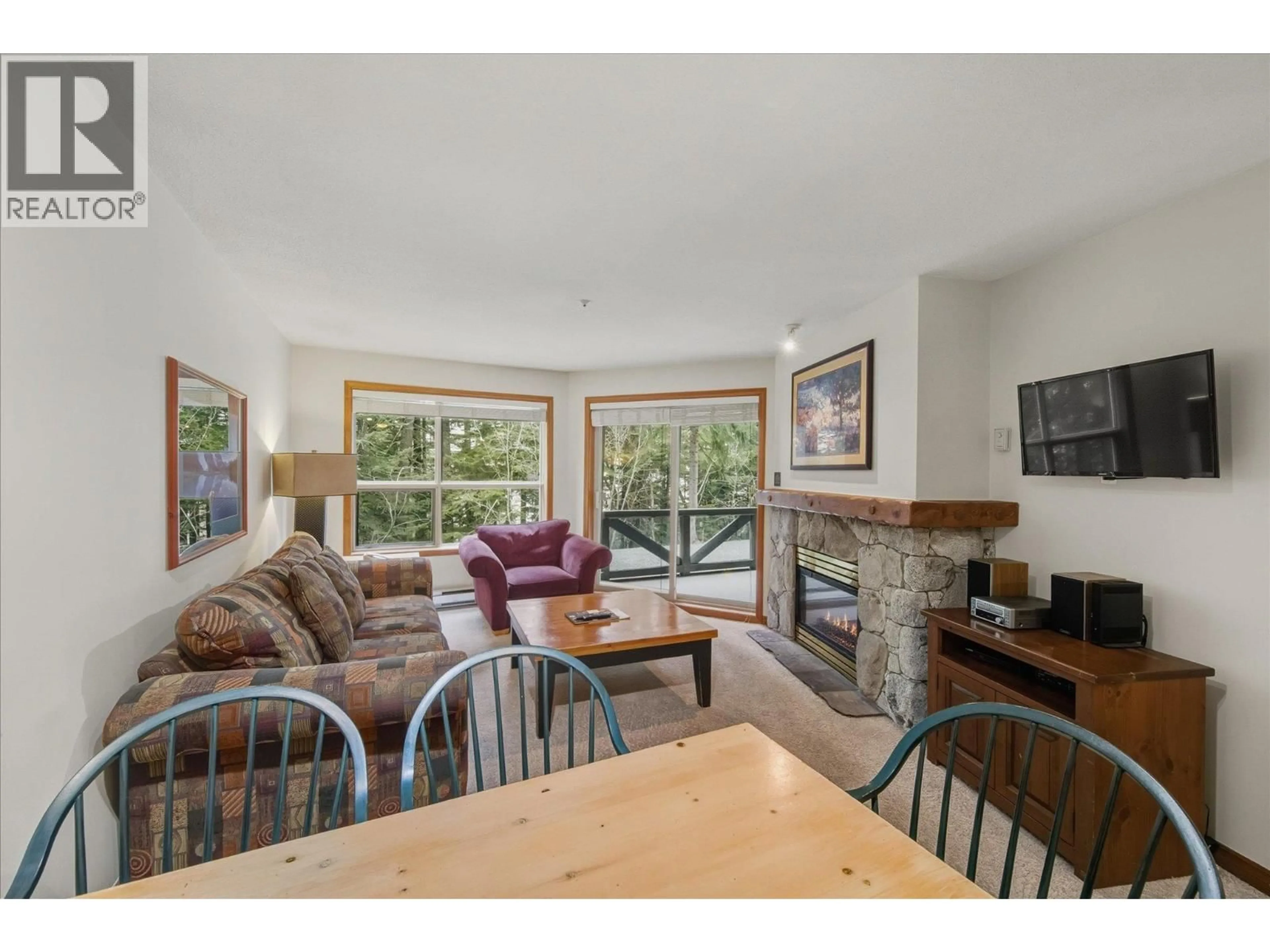 Living room with furniture, wood/laminate floor for 126 - 4800 SPEARHEAD DRIVE, Whistler British Columbia V8E1G1