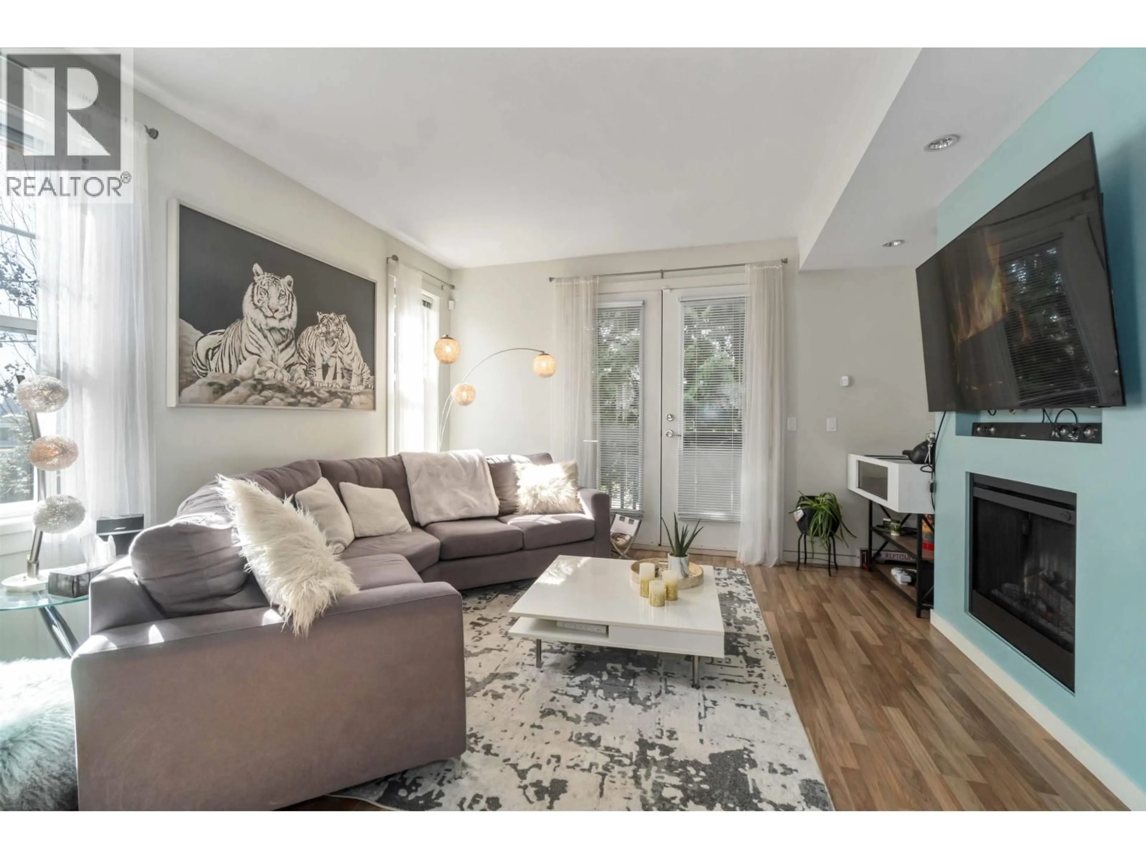 Living room with furniture, wood/laminate floor for 87 - 688 EDGAR AVENUE, Coquitlam British Columbia V3K0A5