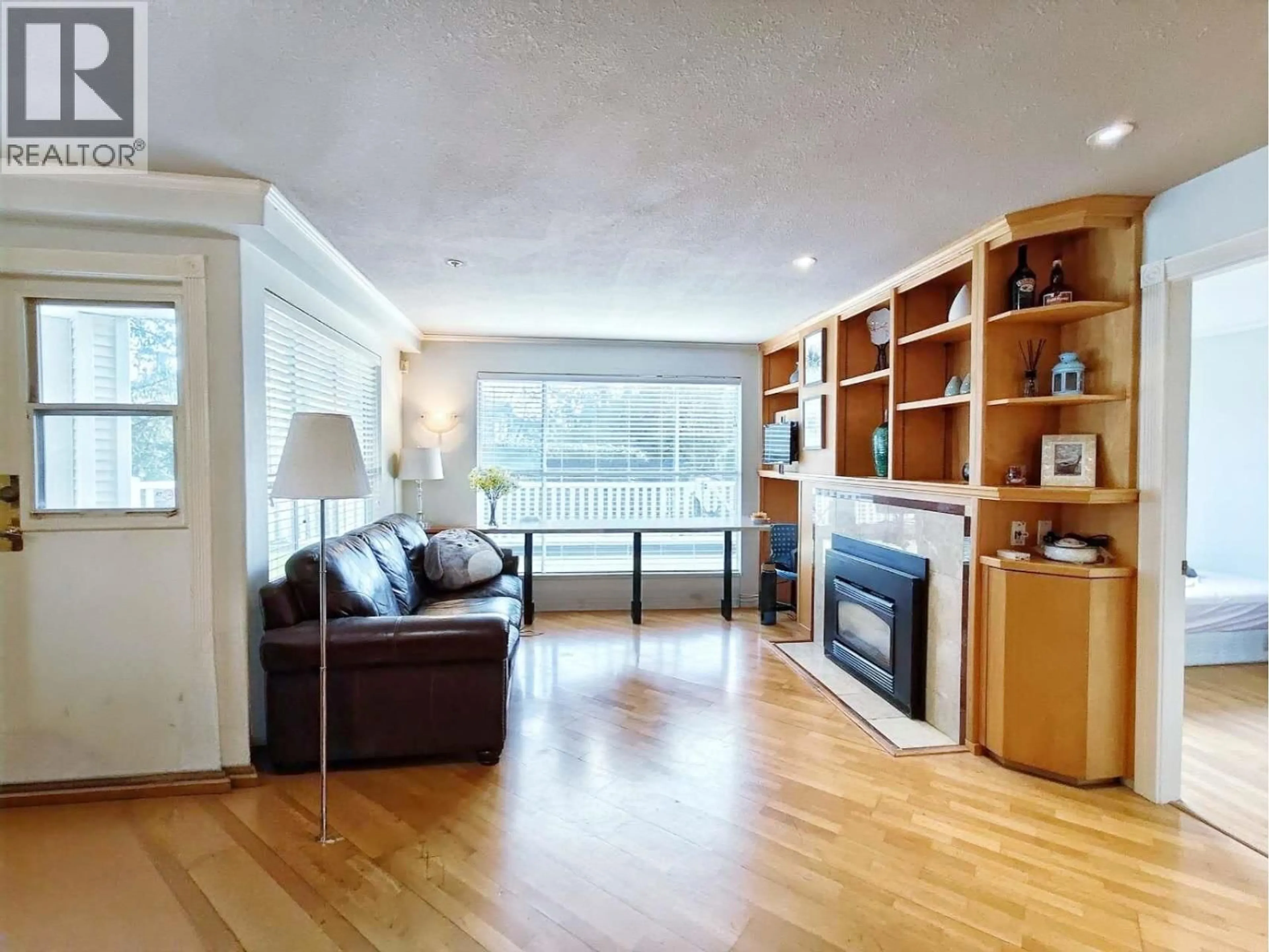 Living room with furniture, wood/laminate floor for 128 - 8880 JONES ROAD, Richmond British Columbia V6Y3Z1