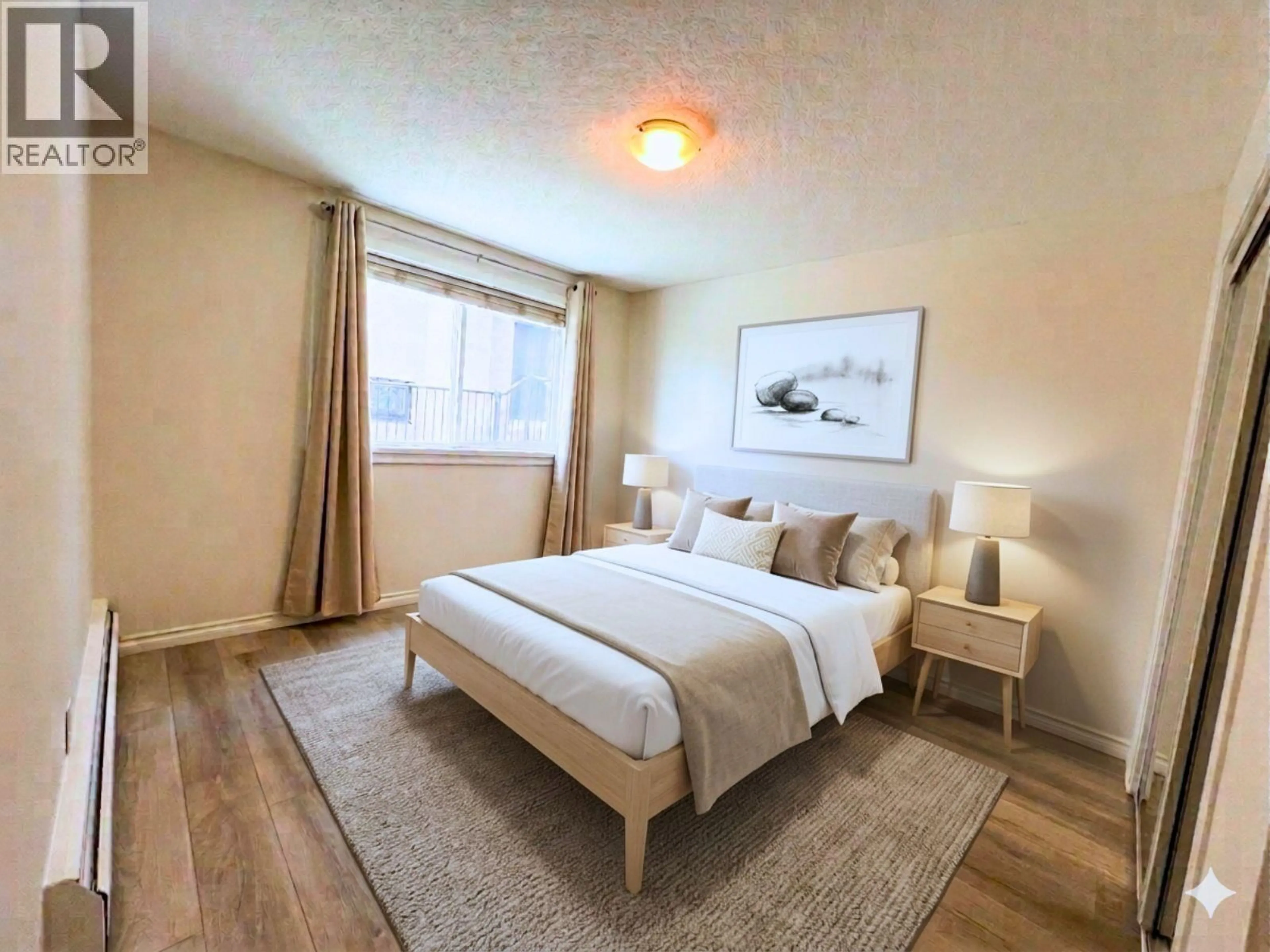 Bedroom with bed, wood/laminate floor for 106 - 2335 YORK AVENUE, Vancouver British Columbia V6K1C8