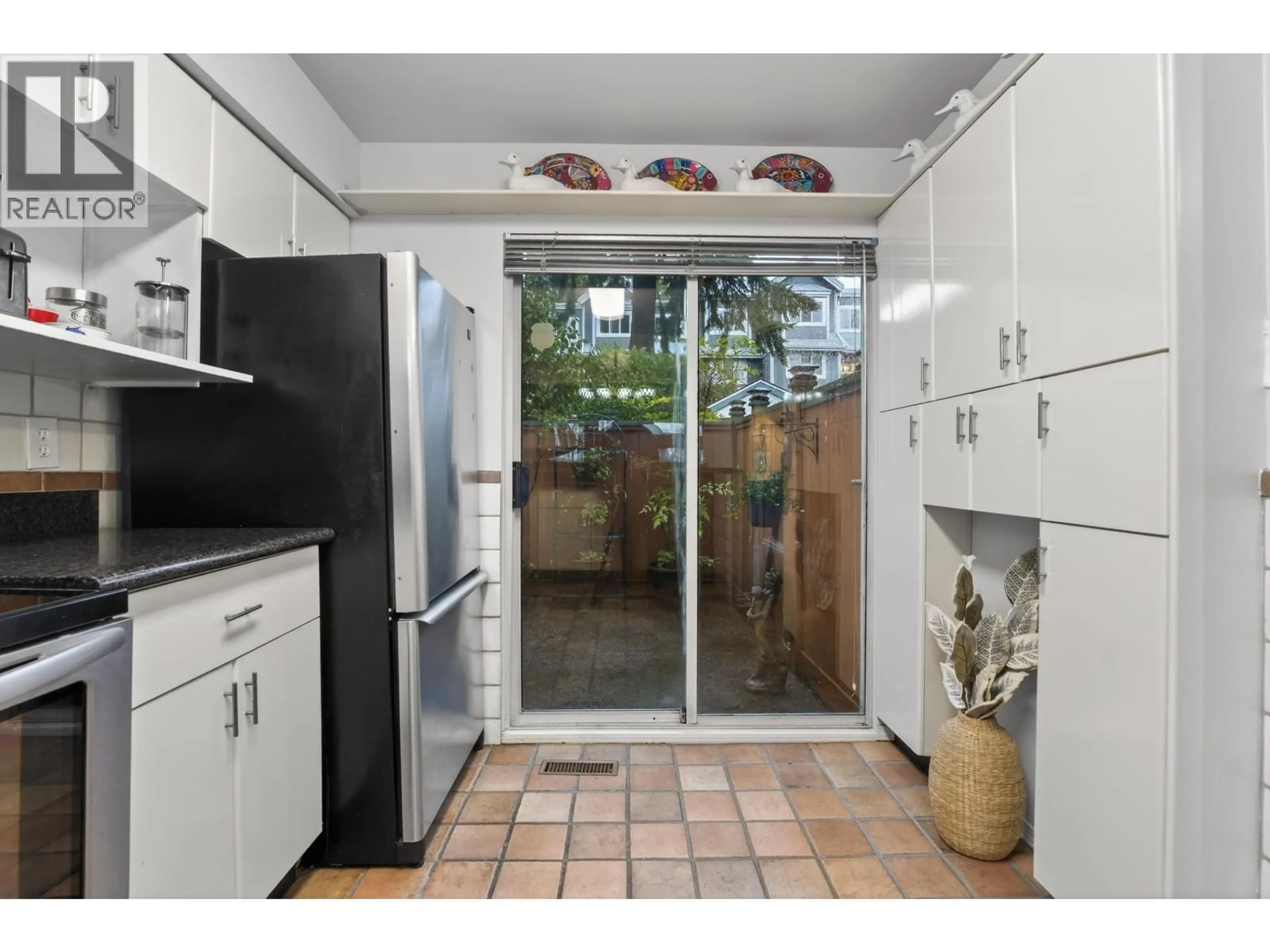 Standard kitchen, ceramic/tile floor for 8489 NANAIMO STREET, Vancouver British Columbia V5P4V8