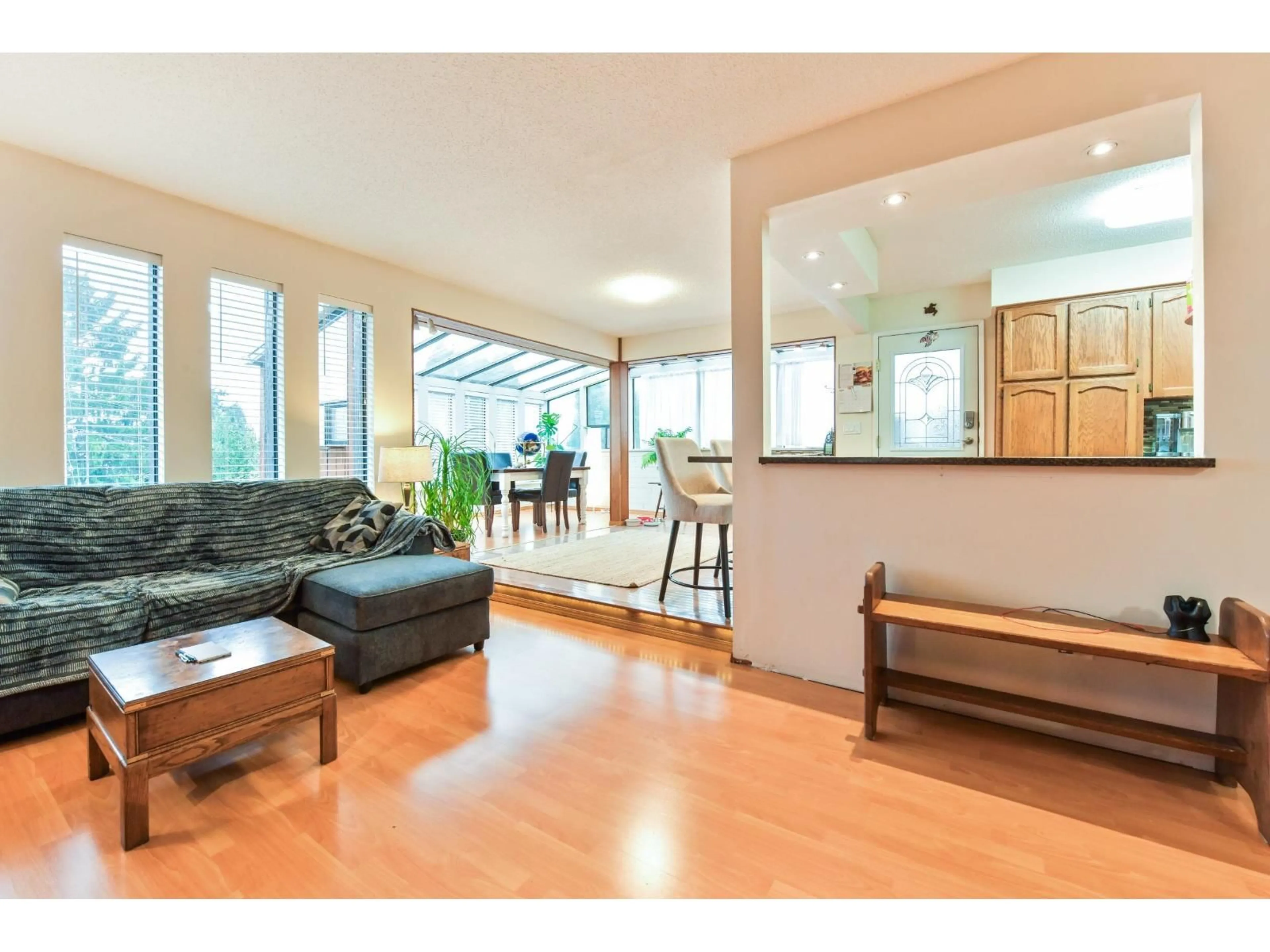 Living room with furniture, wood/laminate floor for 34560 HURST CRESCENT, Abbotsford British Columbia V2S5B4