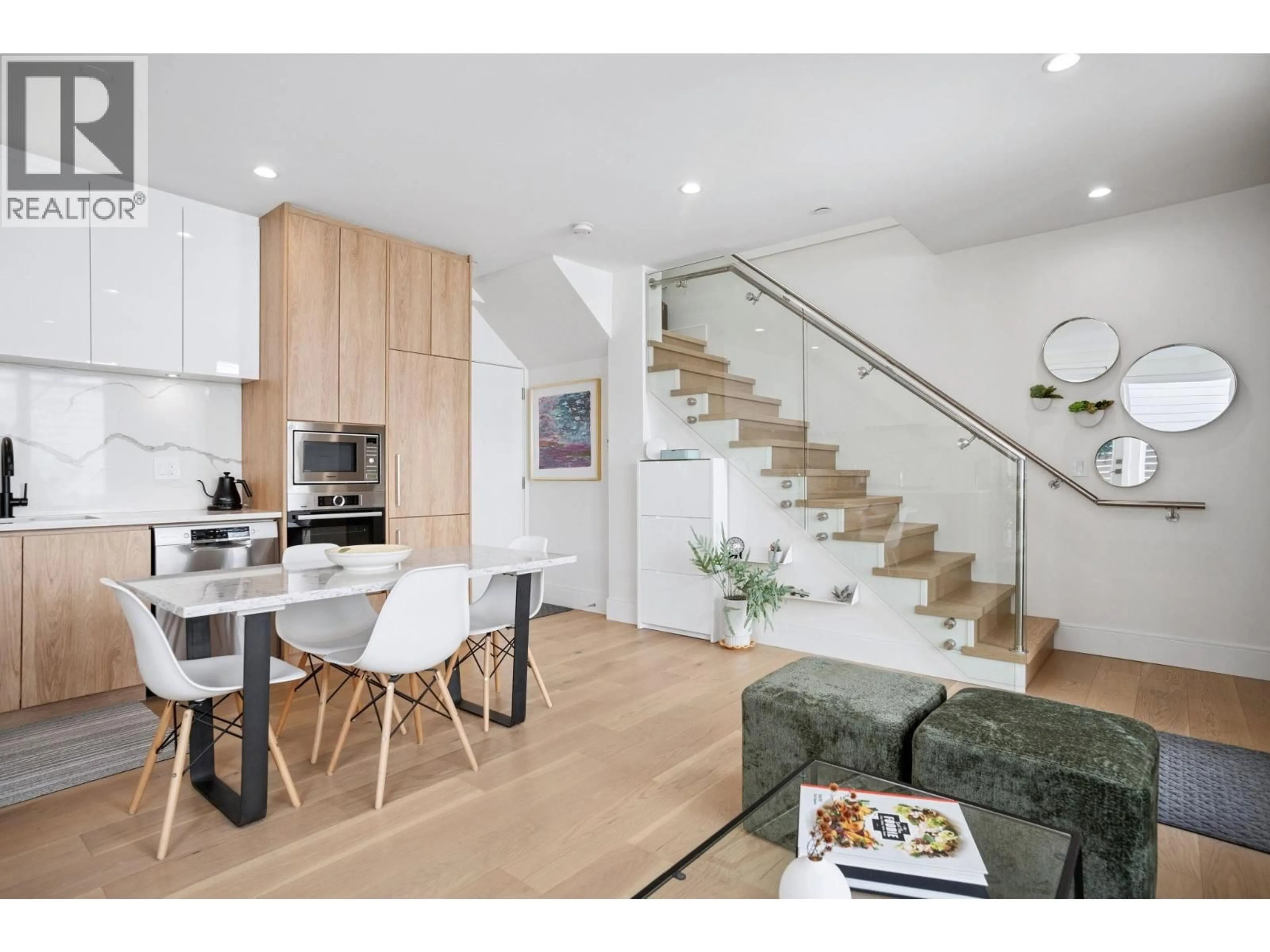 Open concept kitchen, wood/laminate floor for 4419 WELWYN STREET, Vancouver British Columbia V5N3Z3