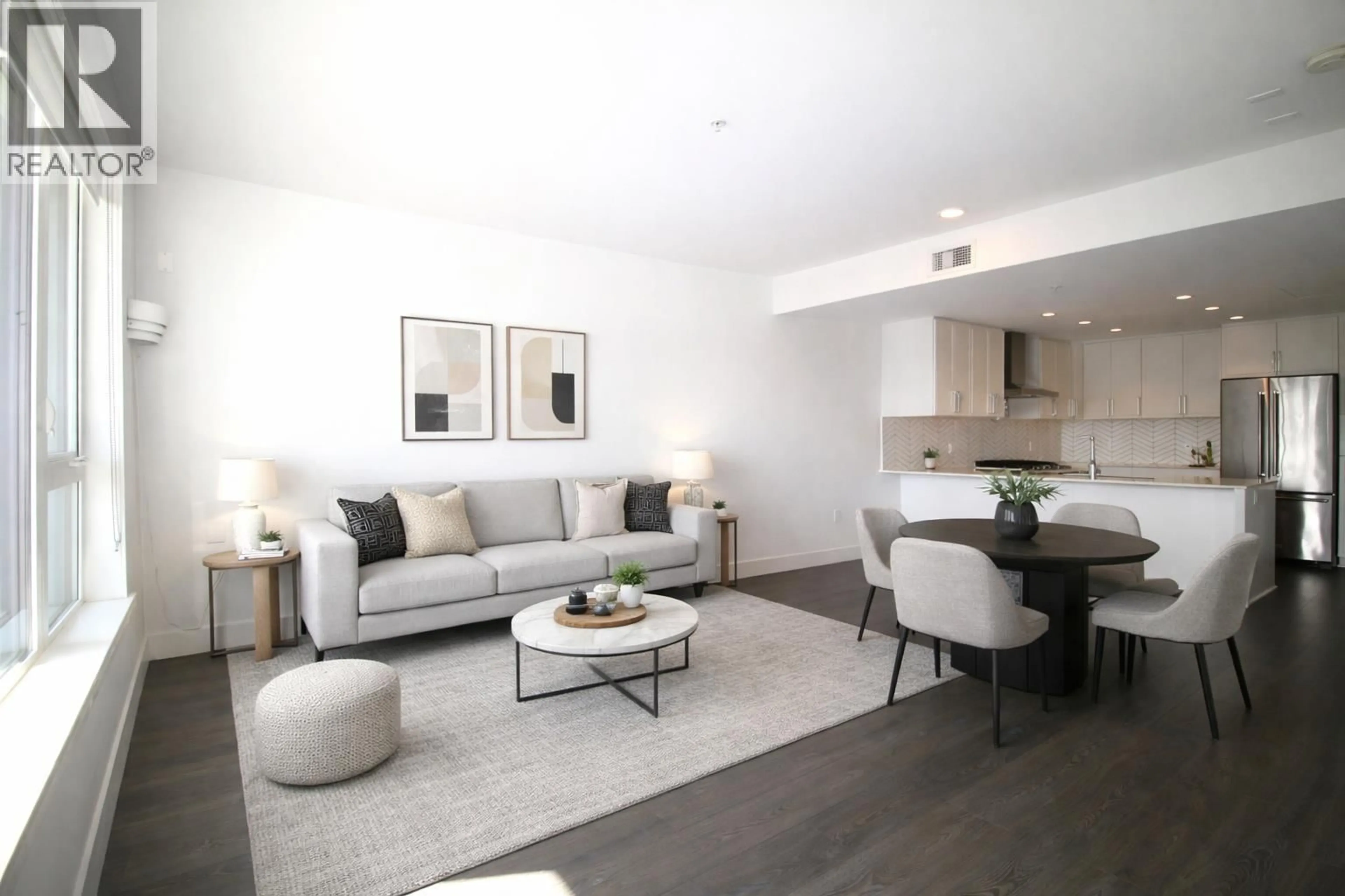 Living room with furniture, wood/laminate floor for 509 - 4477 HASTINGS STREET, Burnaby British Columbia V5C0L6