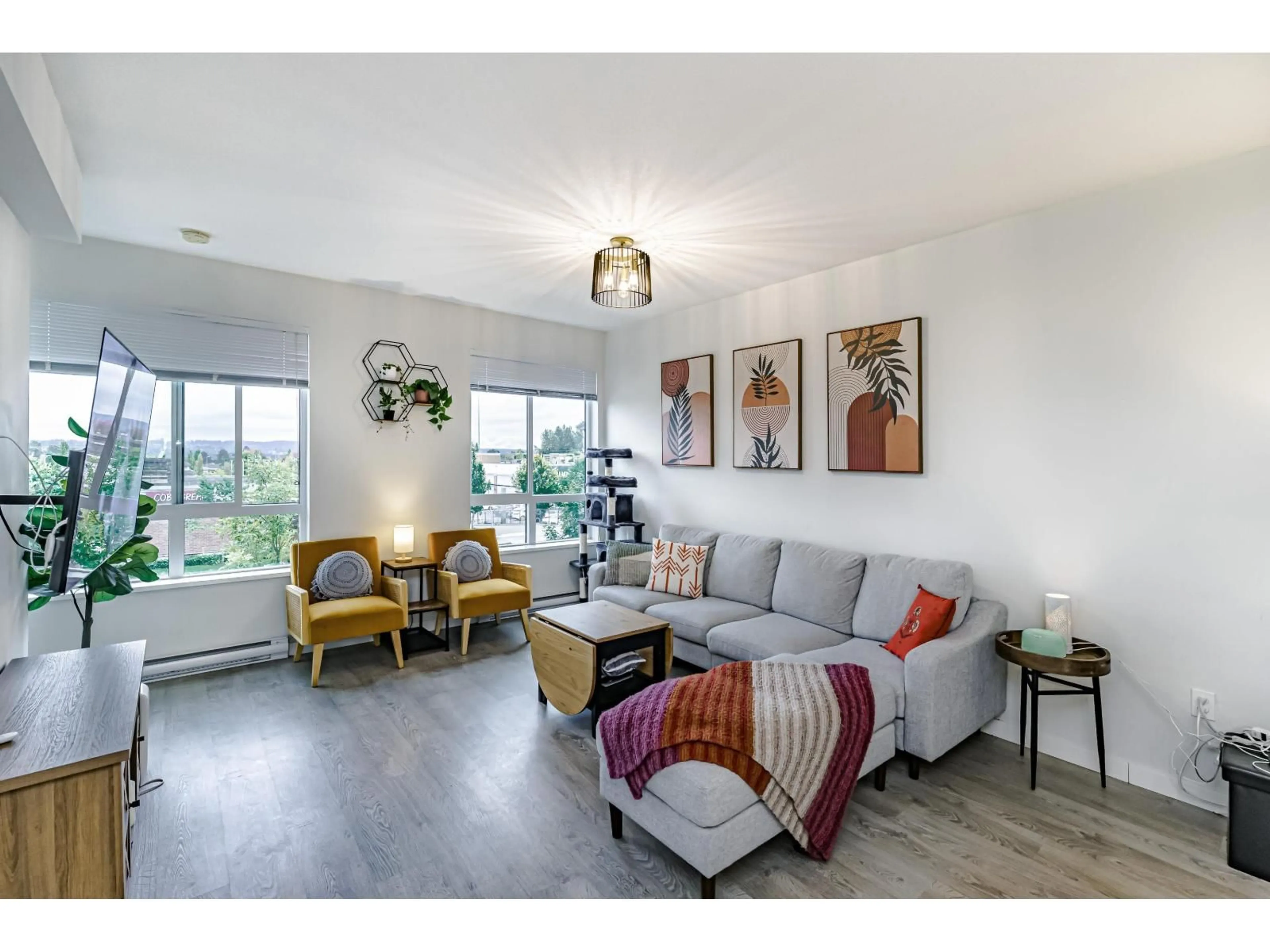 Living room with furniture, wood/laminate floor for 3 - 15151 EDMUND DRIVE, Surrey British Columbia V3S0B2