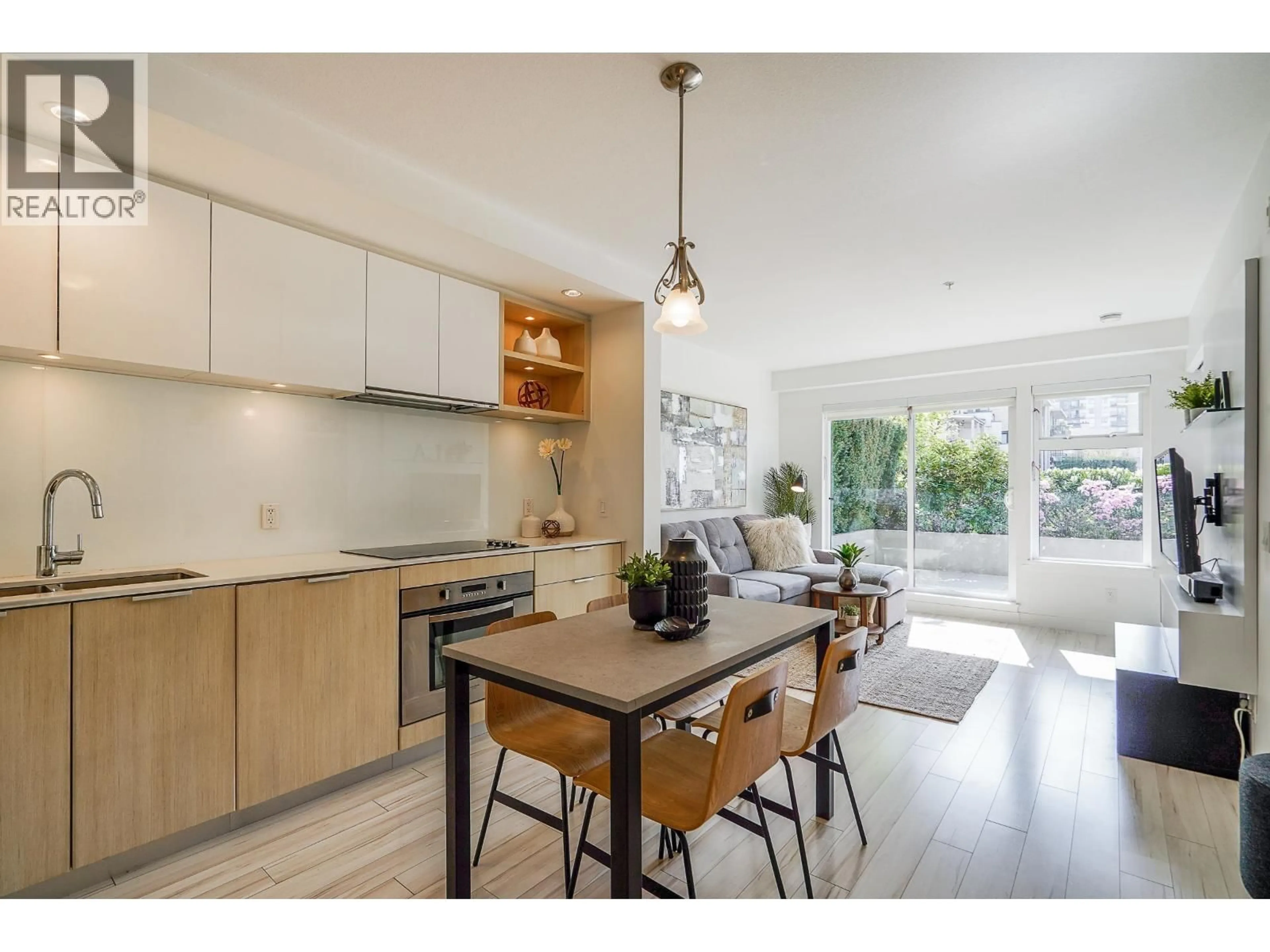 Open concept kitchen, wood/laminate floor for 214 - 111 E 3RD STREET, North Vancouver British Columbia V7L0C6