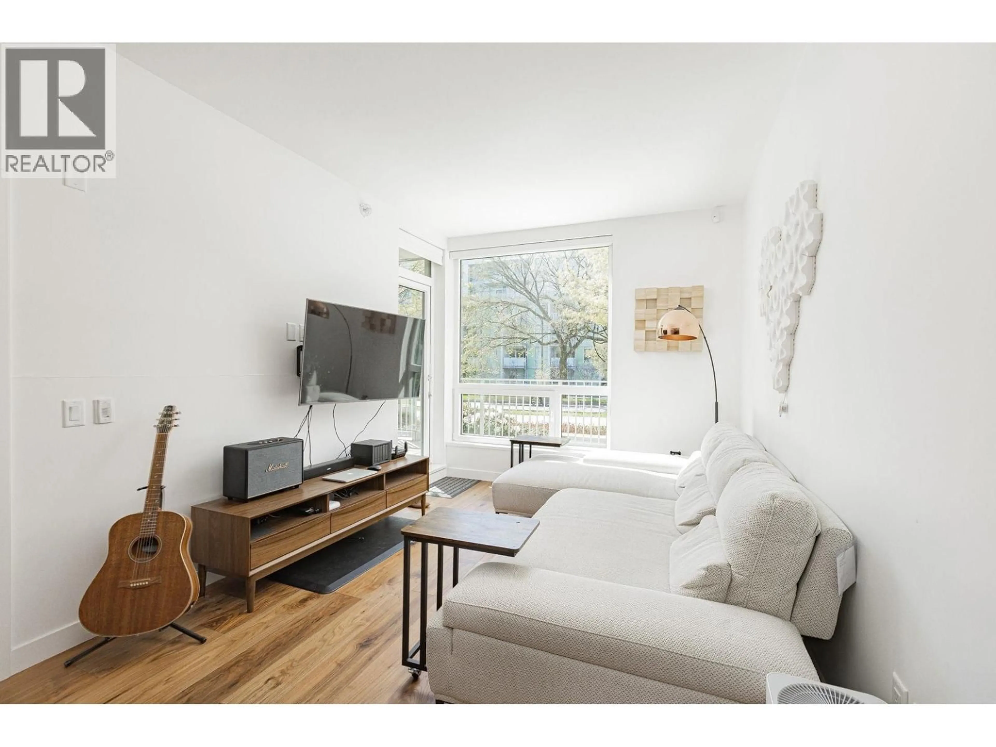 Living room with furniture, wood/laminate floor for 108 - 5058 CAMBIE STREET, Vancouver British Columbia V5Z2Z5