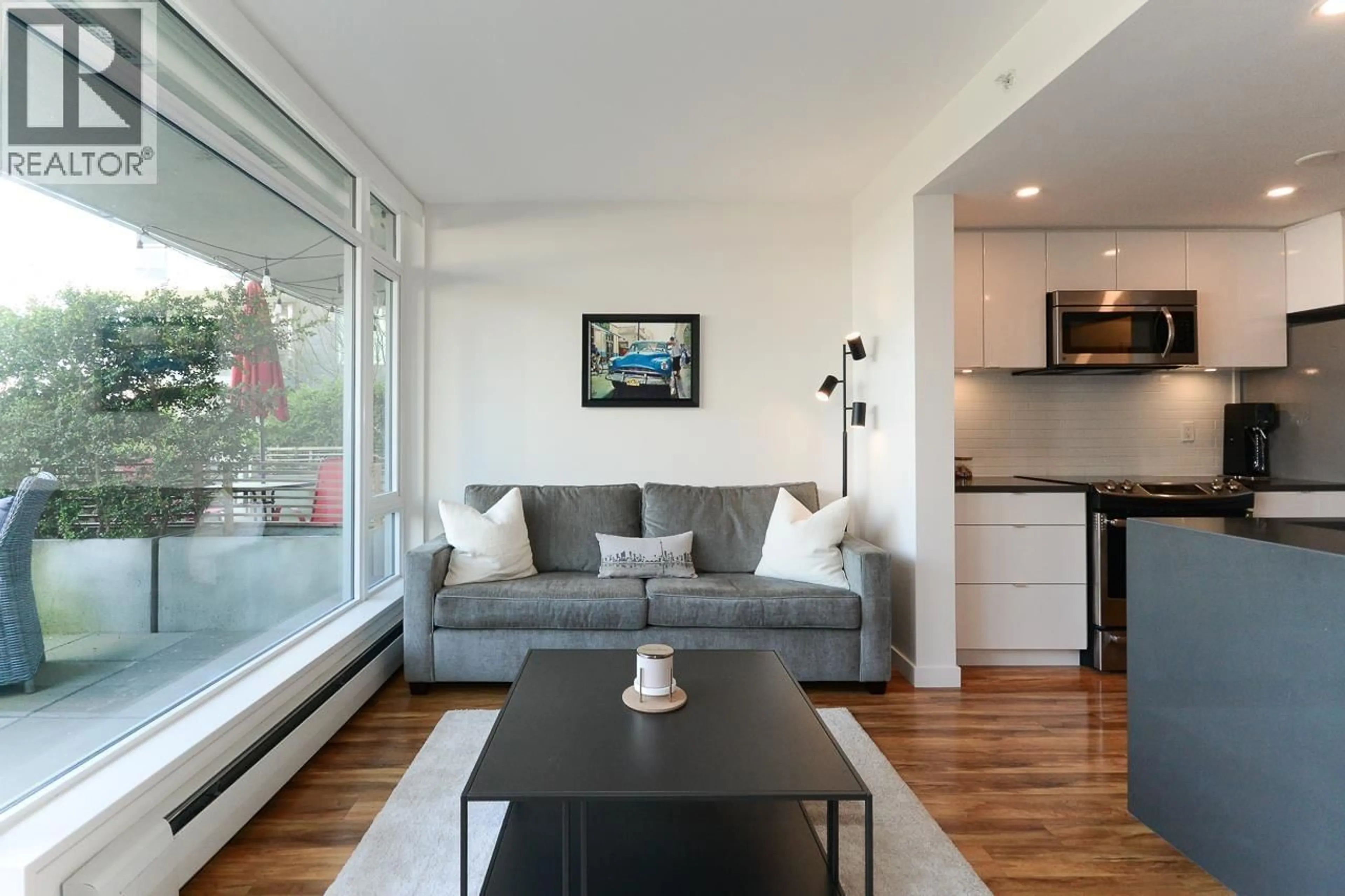 Living room with furniture, wood/laminate floor for 221 - 289 6TH AVENUE, Vancouver British Columbia V5T0E9