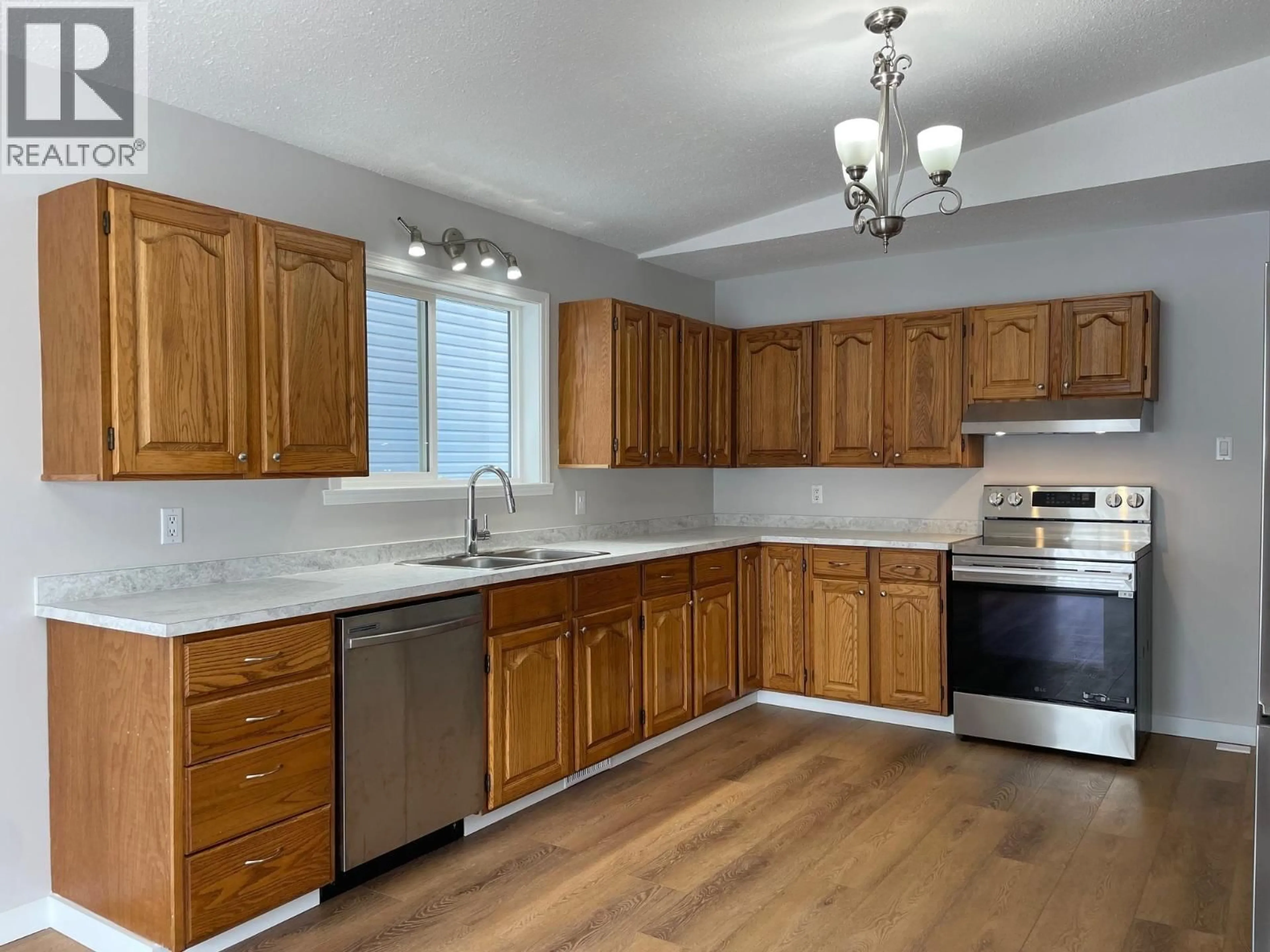 Standard kitchen, wood/laminate floor for 3924 53 AVENUE, Fort Nelson British Columbia V0C1R0