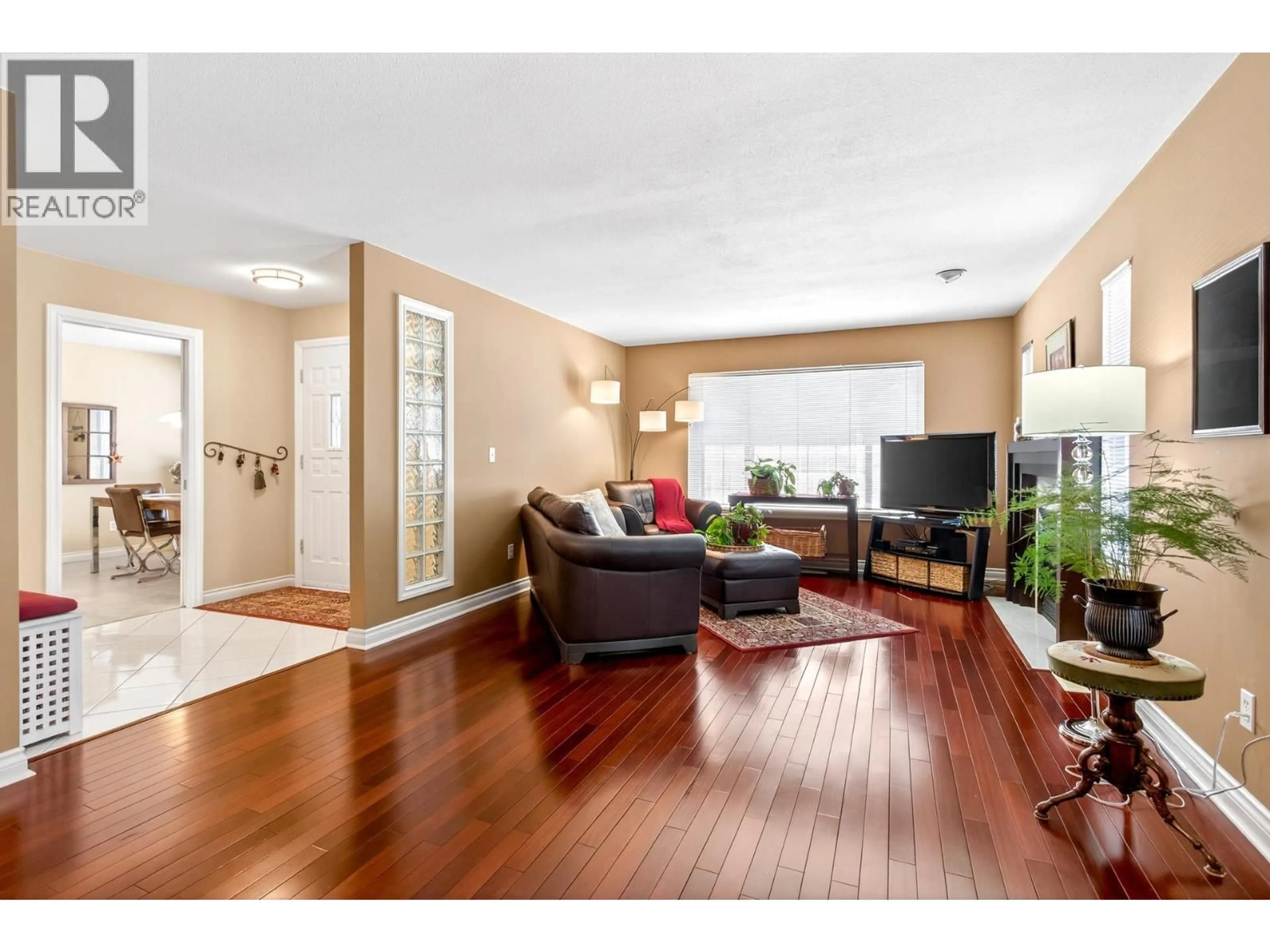 Living room with furniture, wood/laminate floor for 1625 MCHUGH CLOSE, Port Coquitlam British Columbia V3C6E1