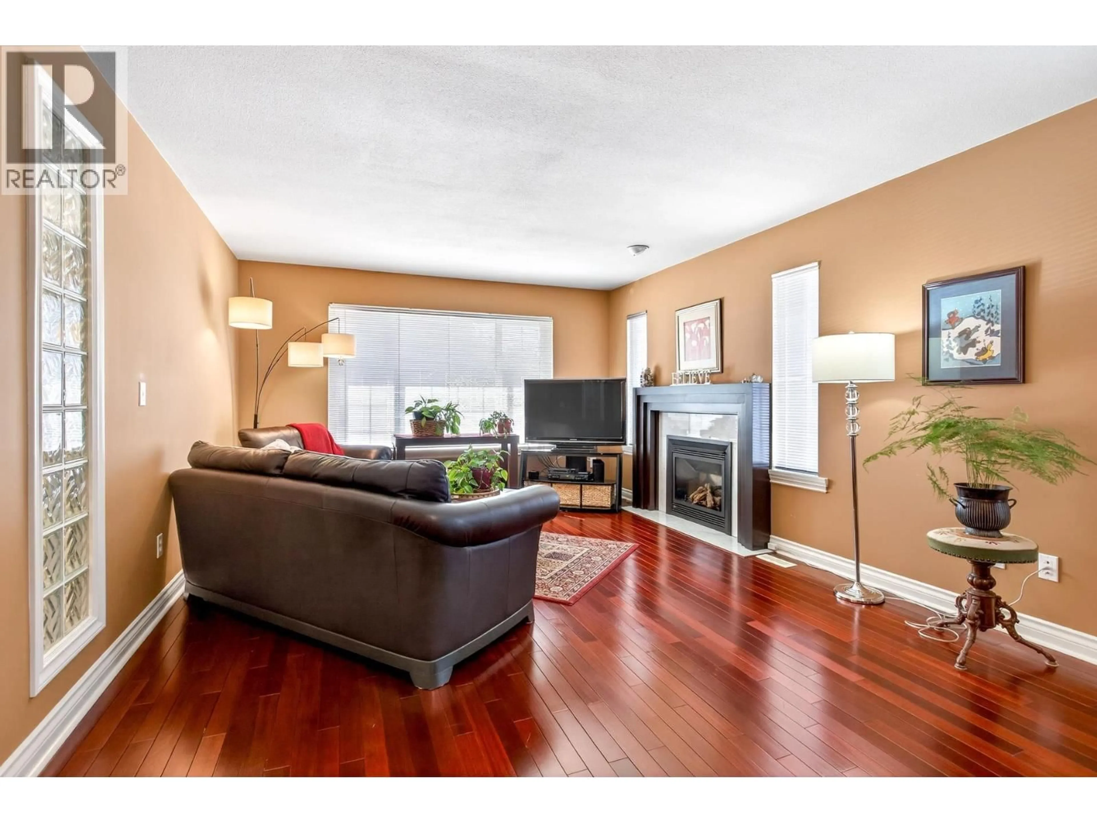 Living room with furniture, wood/laminate floor for 1625 MCHUGH CLOSE, Port Coquitlam British Columbia V3C6E1