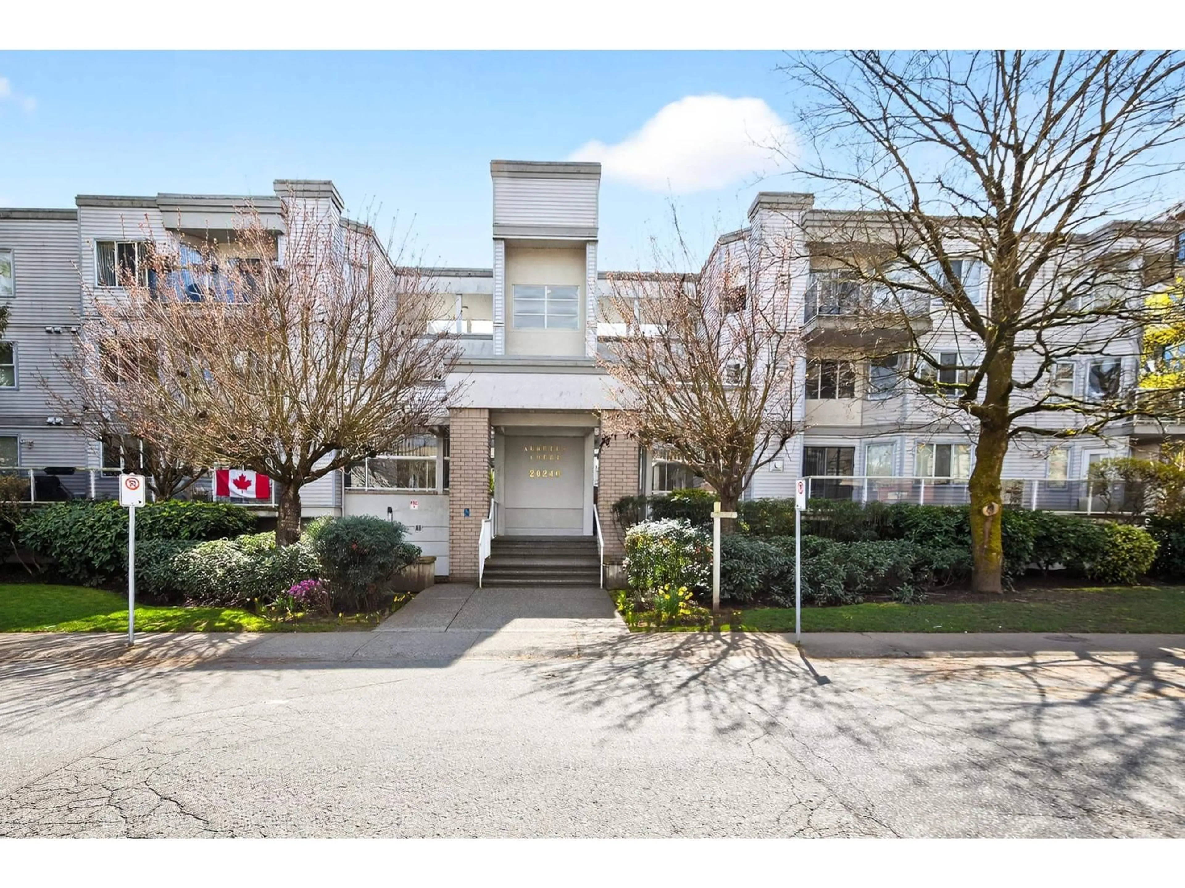 A pic from outside/outdoor area/front of a property/back of a property/a pic from drone, street for 303 - 20240 54A AVENUE, Langley British Columbia V3A3W7