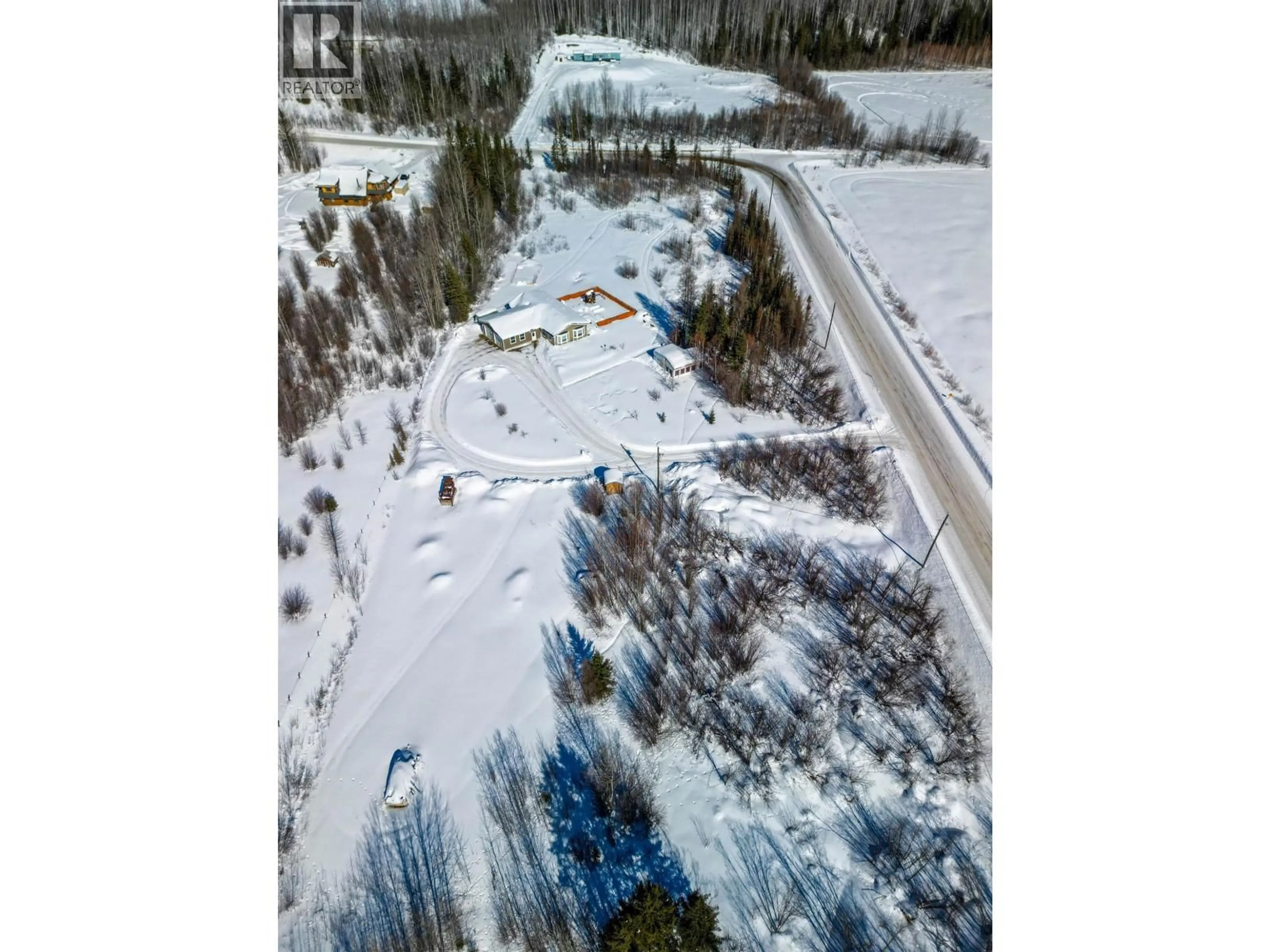 A pic from outside/outdoor area/front of a property/back of a property/a pic from drone, street for 34 PEBBLE DRIVE, Fort Nelson British Columbia V0C1R0